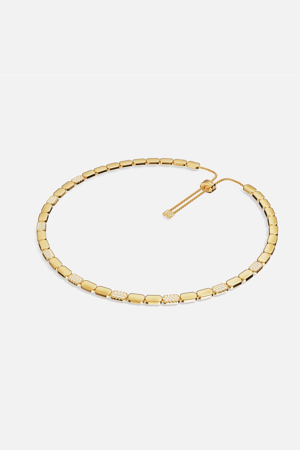 APM Necklace in golden color, a sleek rhythm of shine and sparkle.