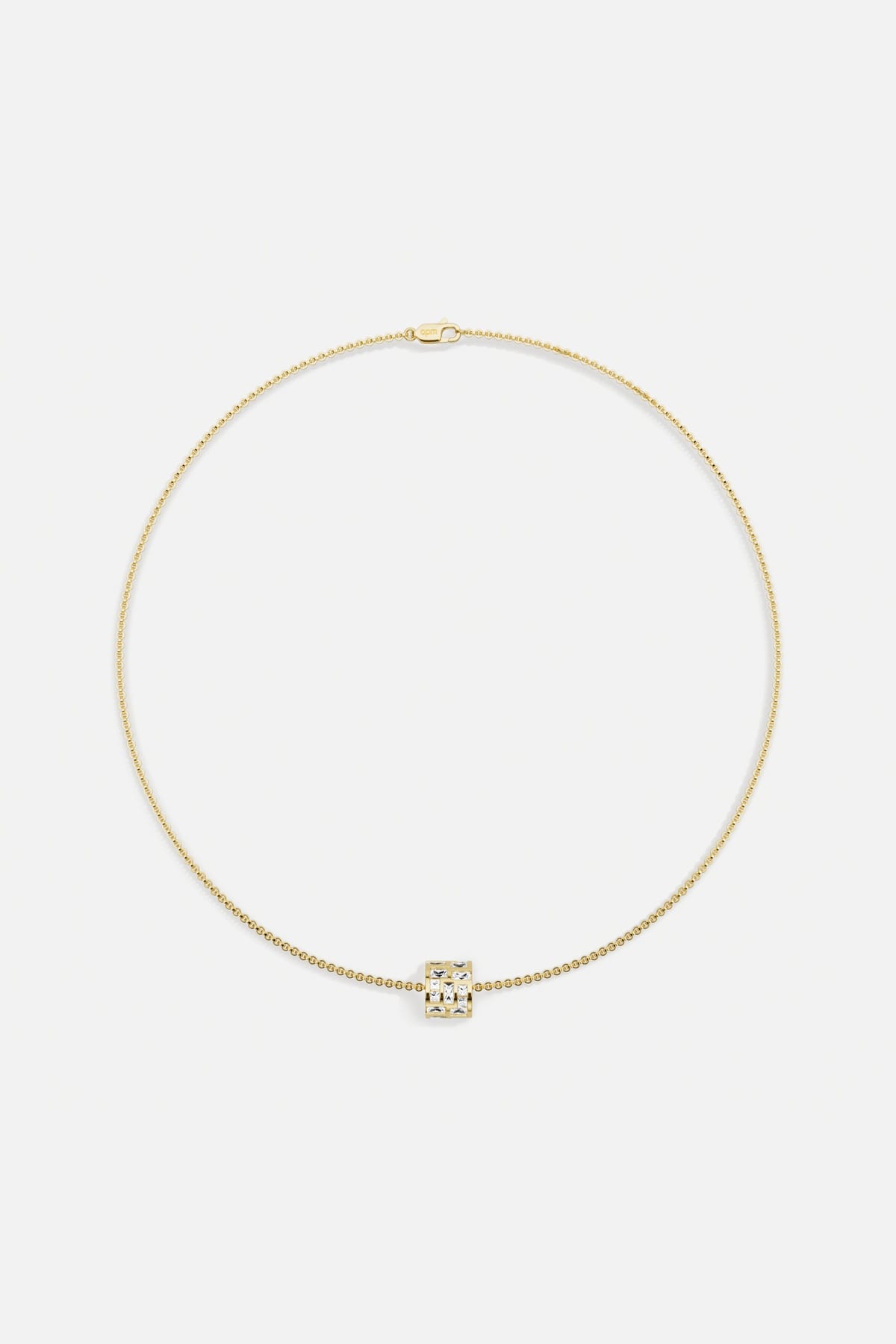 APM Necklace in golden color, a luminous charm for effortless everyday elegance.