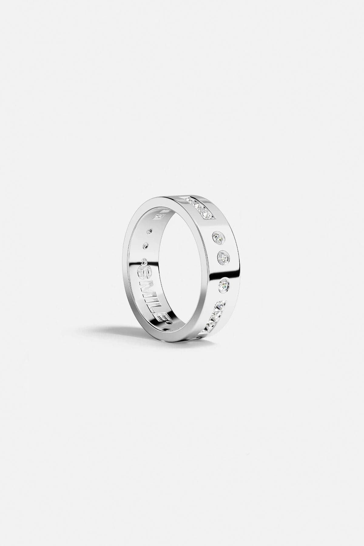 Rings APM Monaco: silver-tone Morse-code ring with scattered stones and SMILE engraving on the inner band.