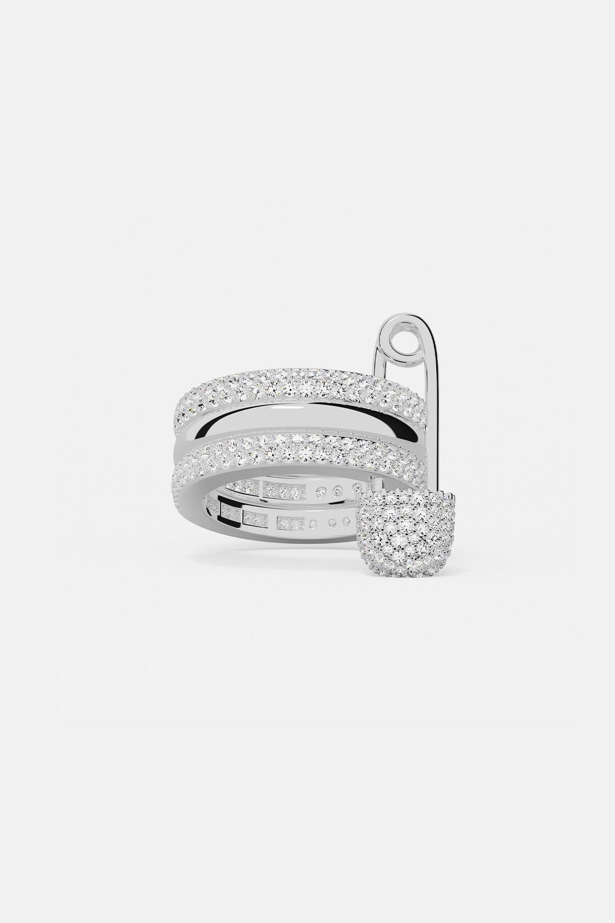 Rings APM Monaco, white ring with triple-hoop design and safety-pin motif with pavé diamonds.