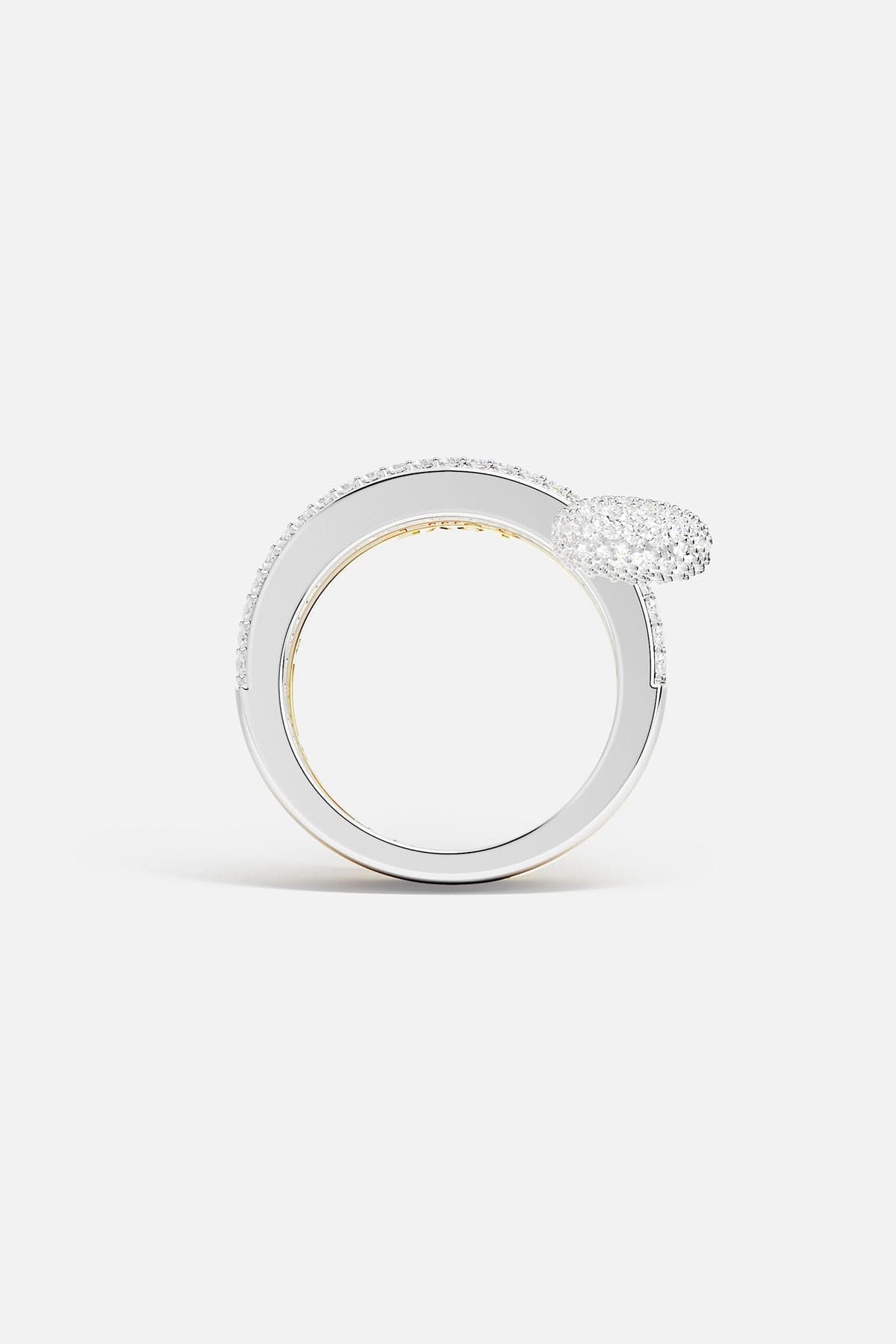 Rings APM Monaco fashion jewelry: a white, triple-hoop safety-pin ring with pavé cubic zirconia, paired with two additional cubic zirconia rings.