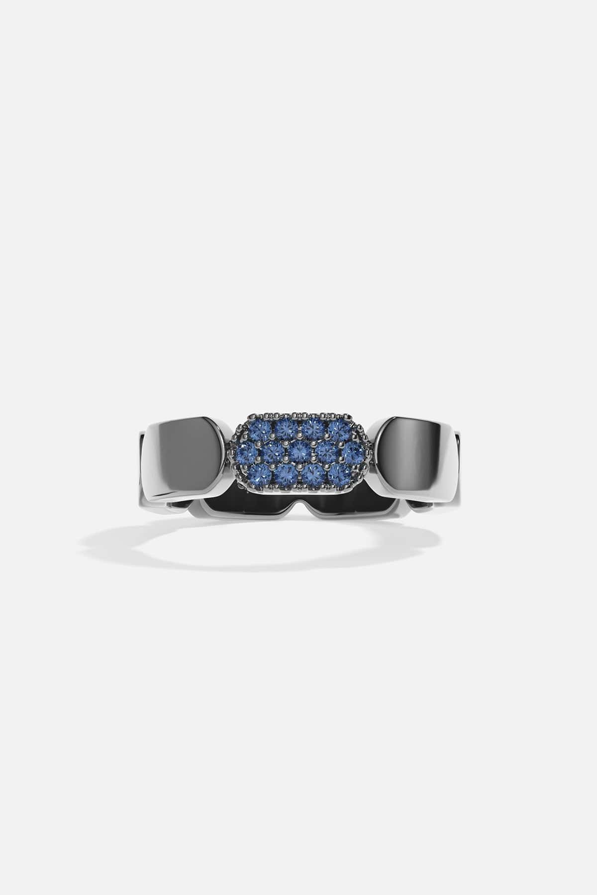 Silver ring with blue stones on a white background