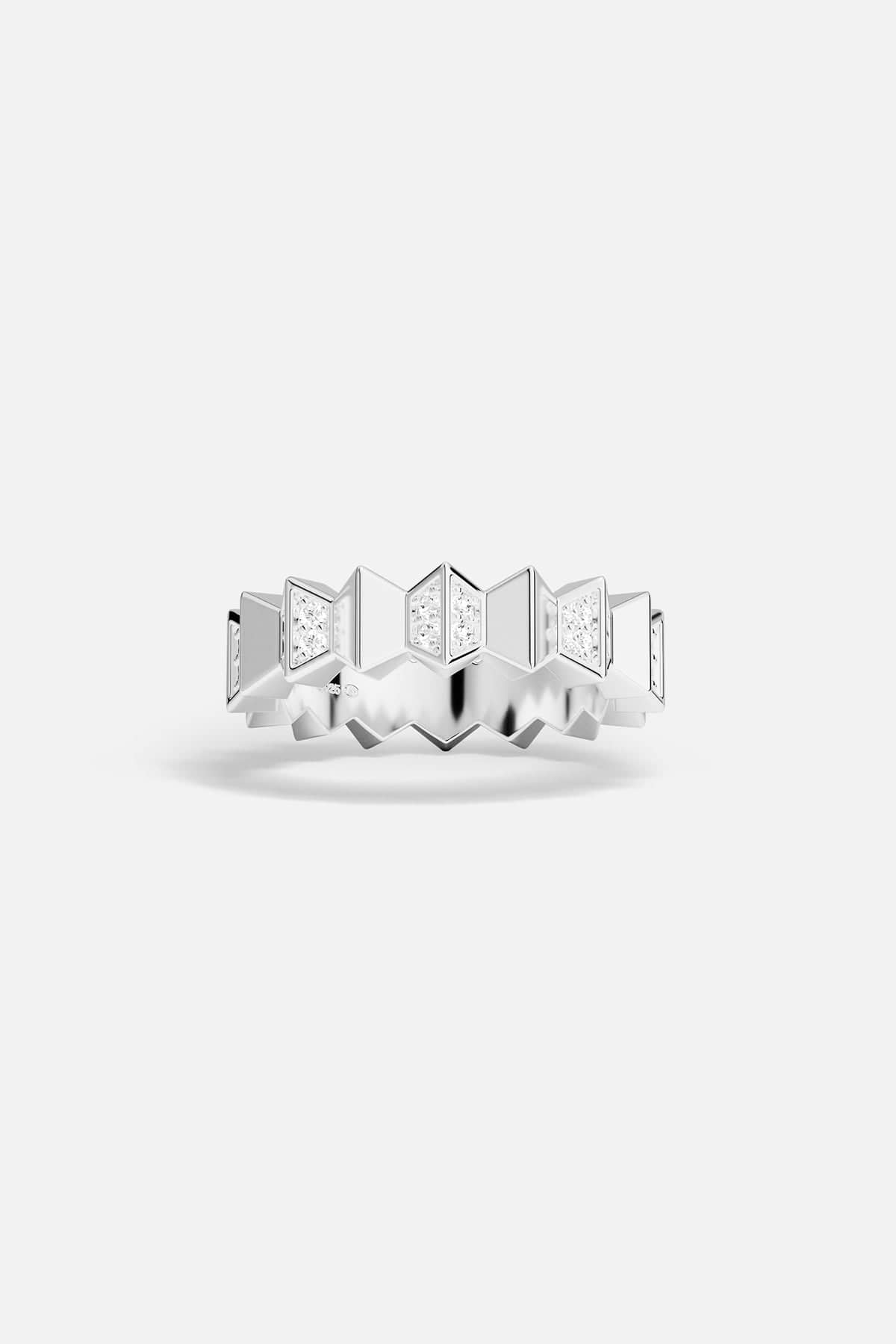 Silver ring with geometric design on a white background