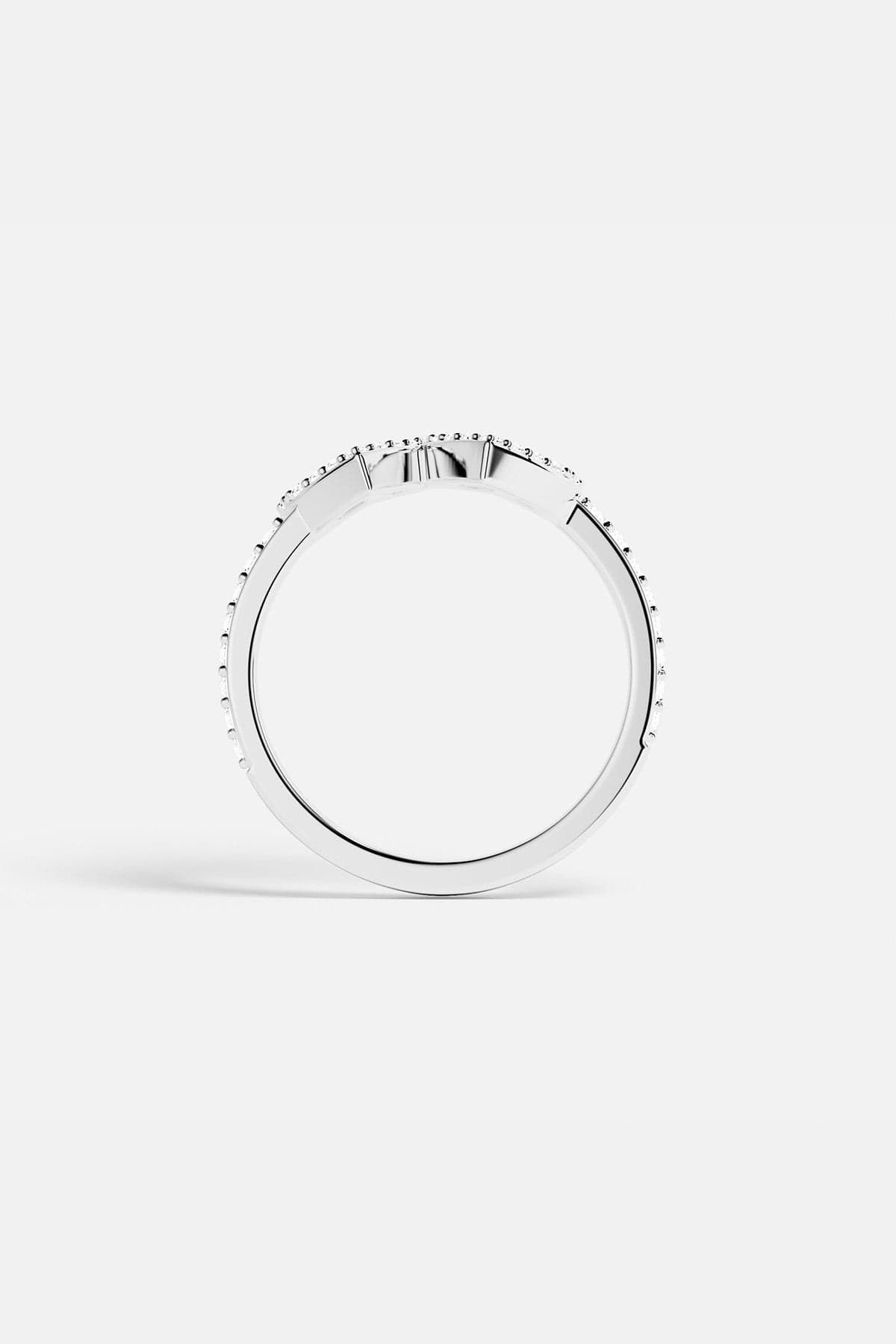 APM MONACO silver ring with two heart-shaped designs on a white background