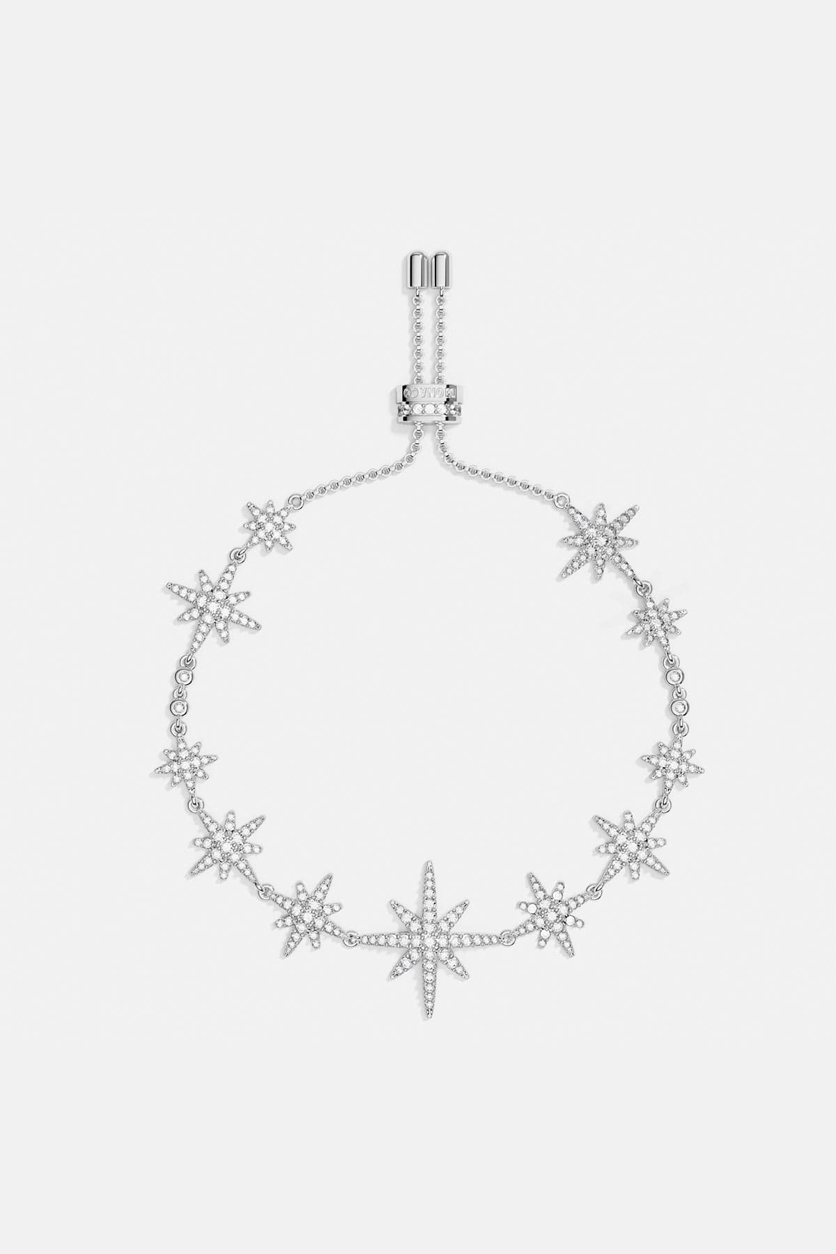 Bracelets APM Monaco: silver adjustable bracelet with a star-shaped charm, chain detail, and toggle clasp, featuring multi-meteorite accents.