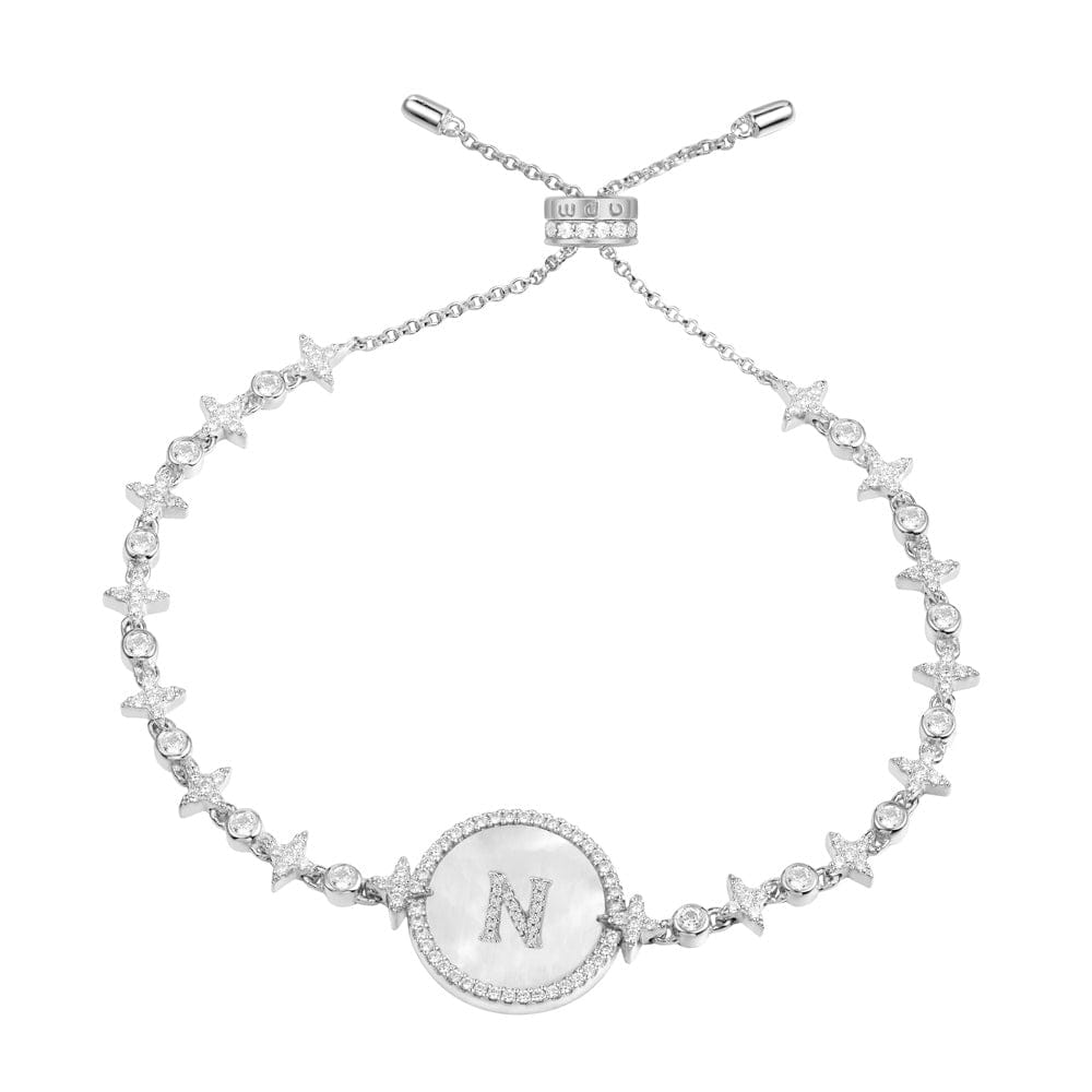 Bracelets APM Monaco: silver-tone chain bracelet with a circular pendant bearing the letter N.
