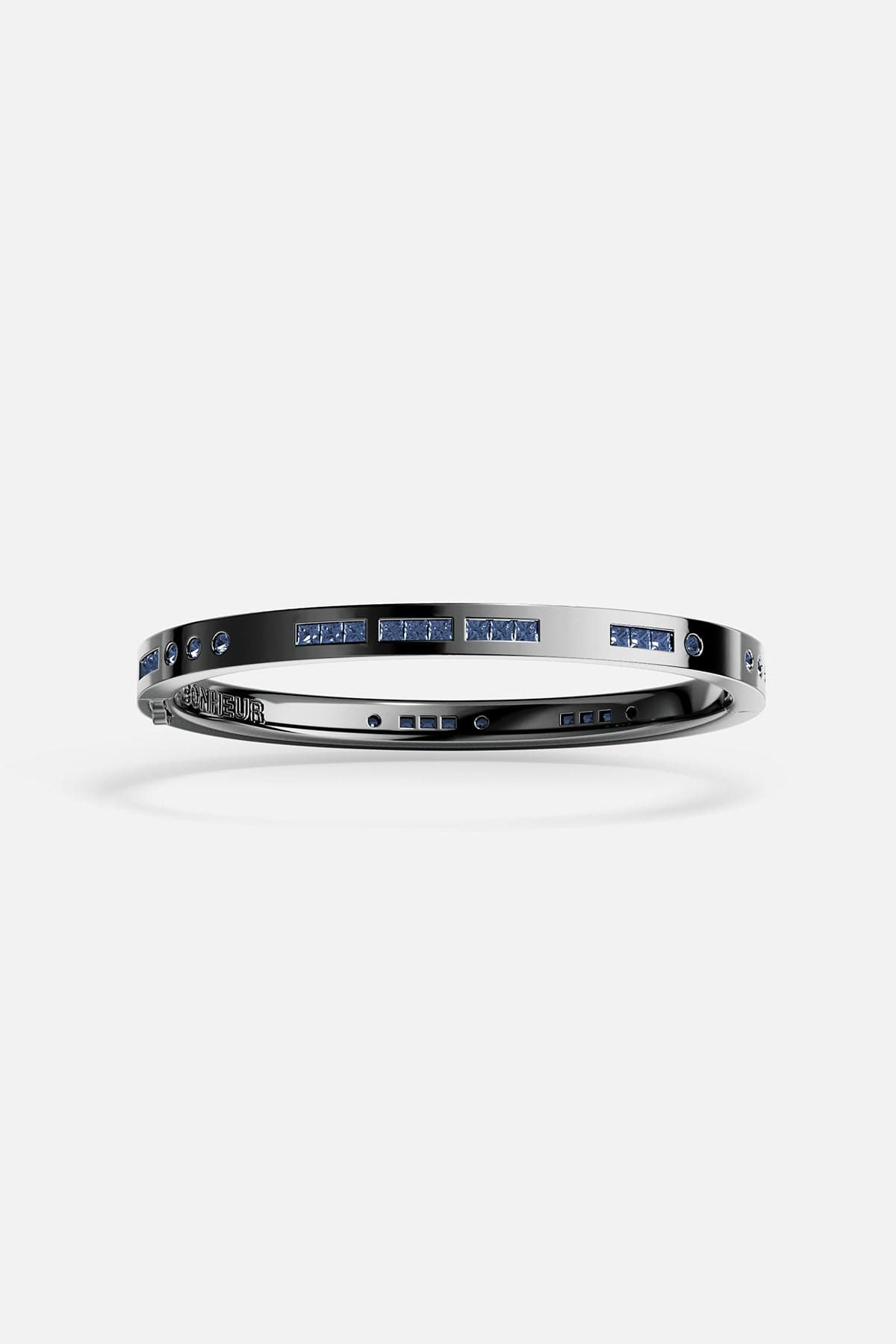 Bracelets APM Monaco gray Morse-code bangle with blue stones spelling Bonheur on a metal band.