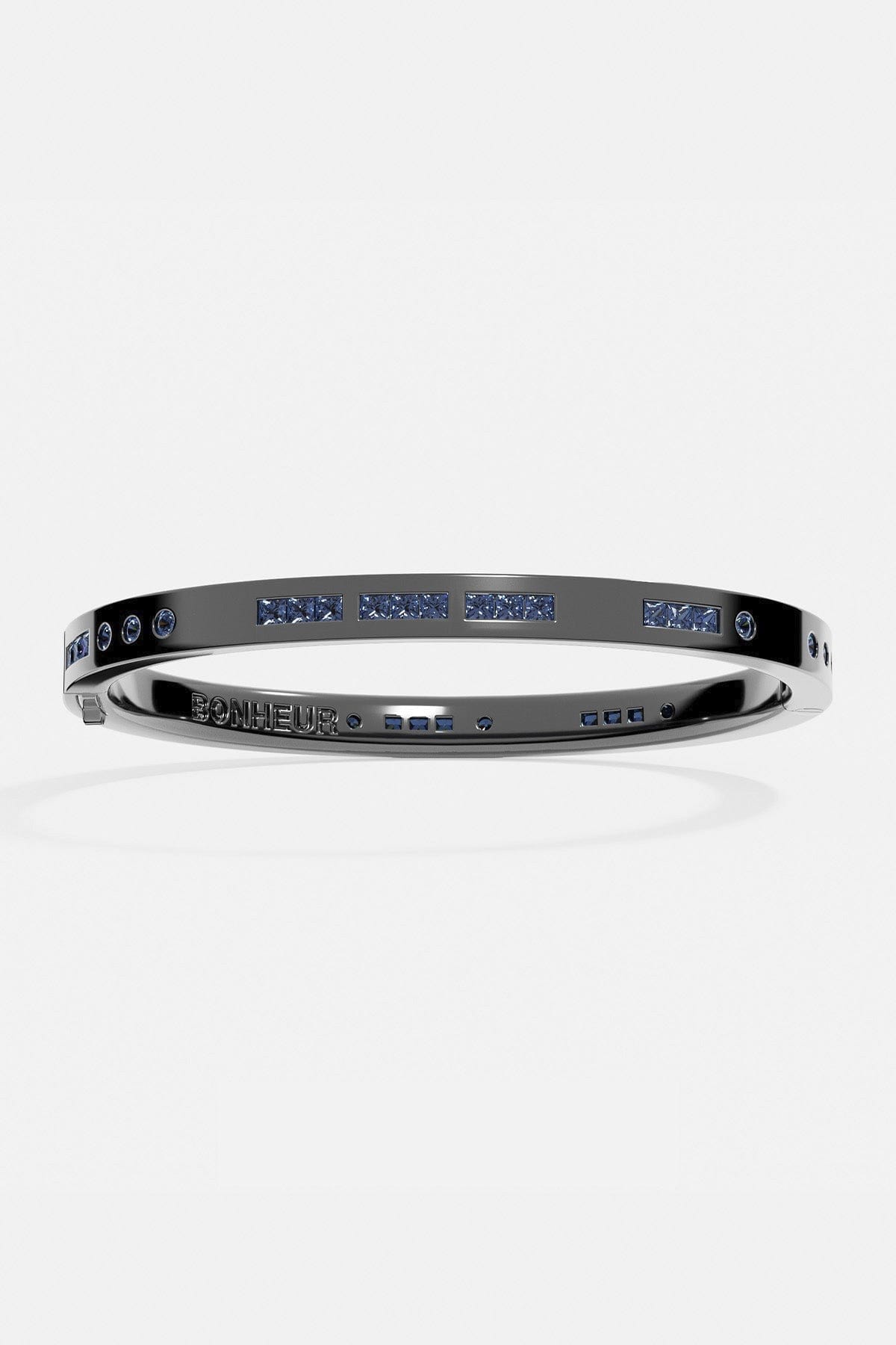 Bracelets APM Monaco gray Morse-code bangle with blue stones spelling Bonheur on a metal band.