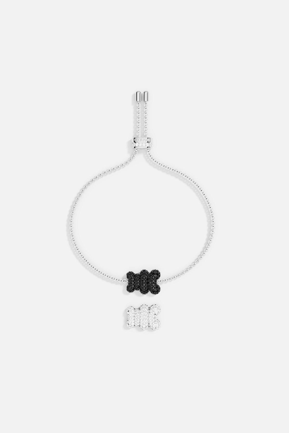 Bracelets APM Monaco adjustable with a silver chain and a black and white motif accented by diamonds.