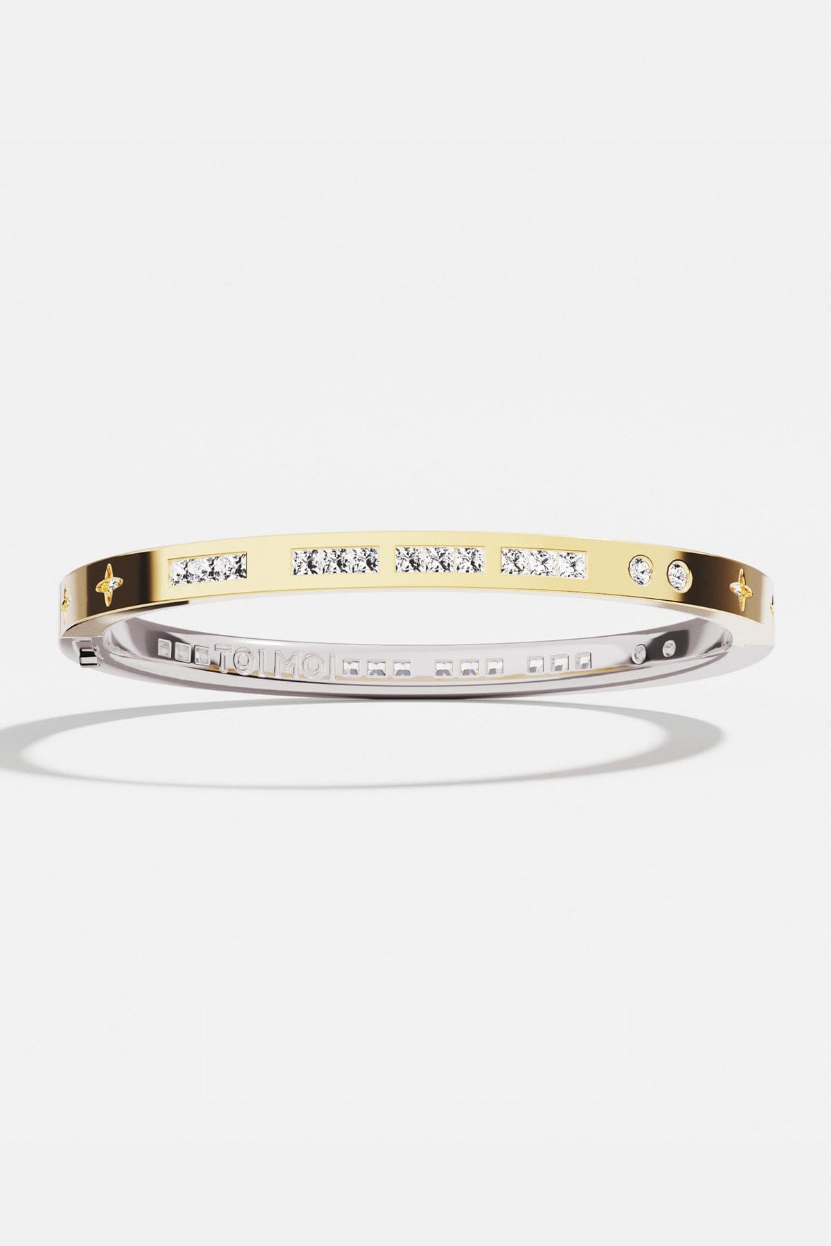 Bracelets APM Monaco two-tone morse-code bangle with crystals and star accents.