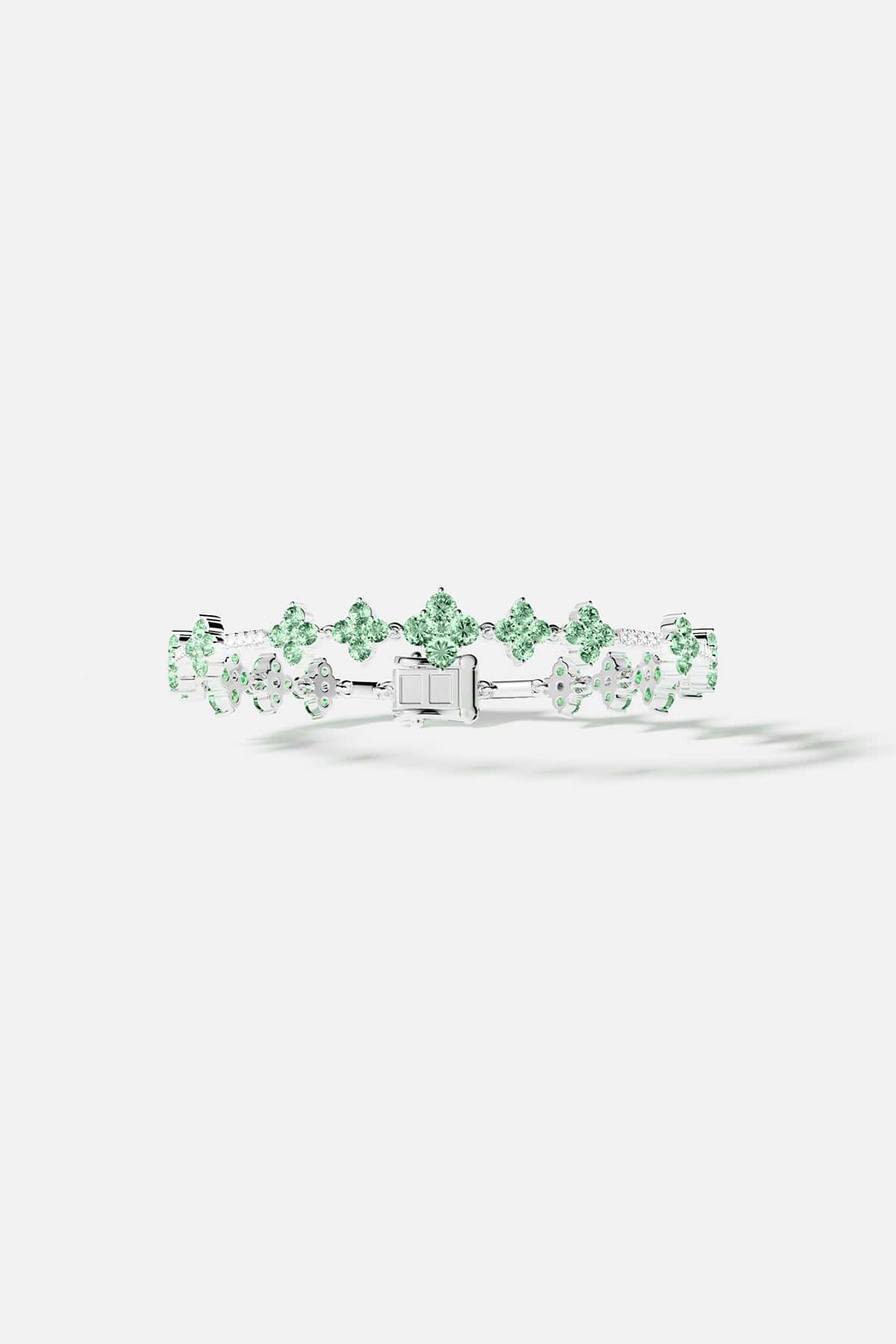 Bracelets APM Monaco. pastel-green stones set in a silver pavé bracelet.