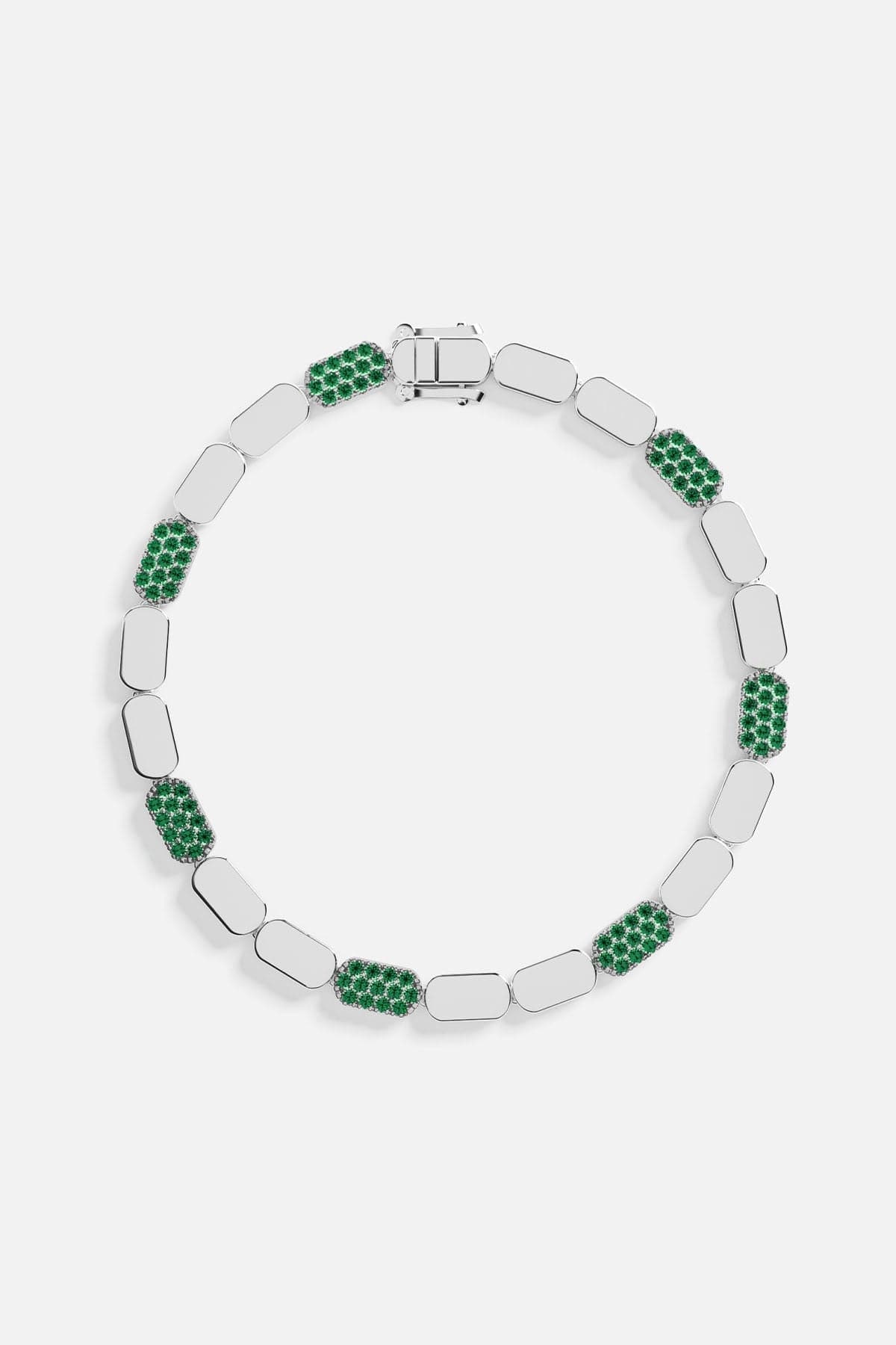 Silver bracelet with green stones on a white background