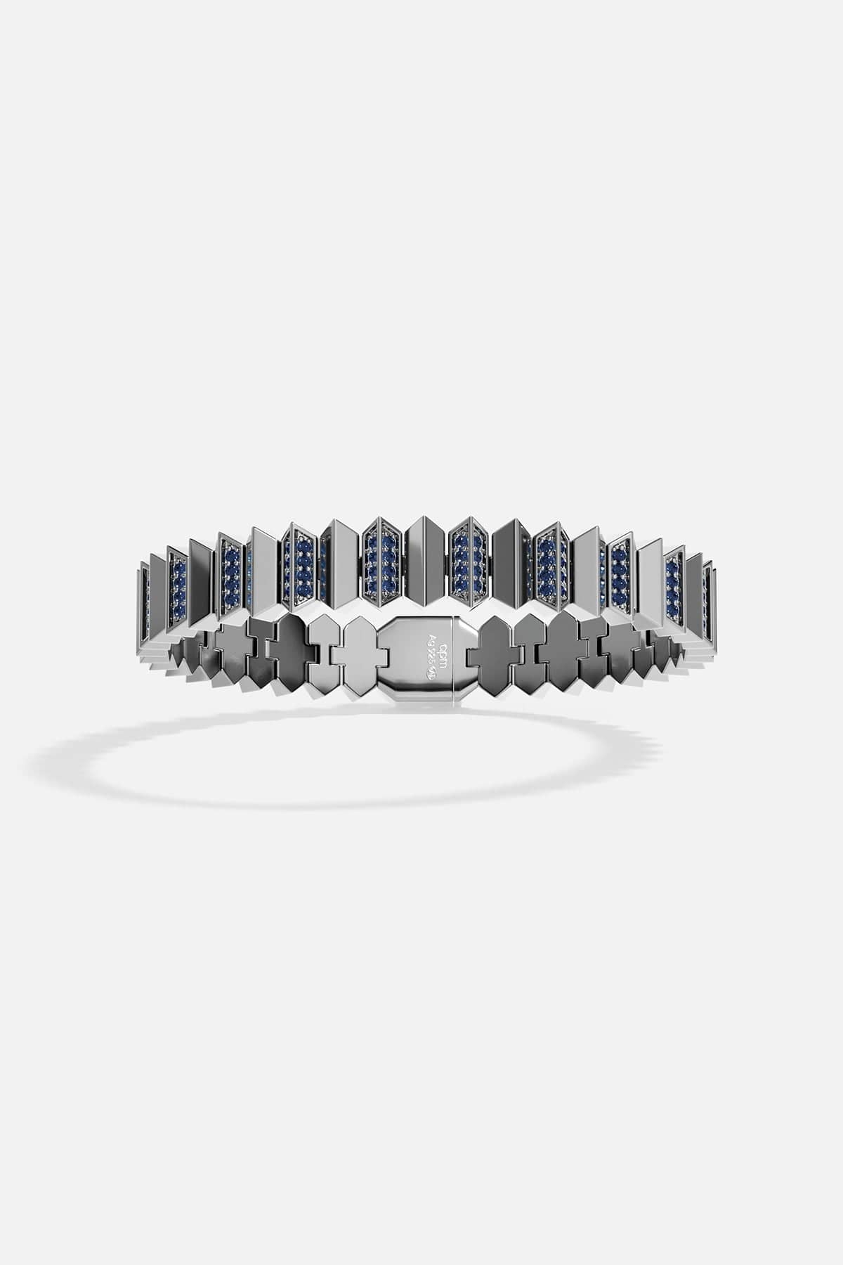 Bracelet with geometric design and blue stones on a white background