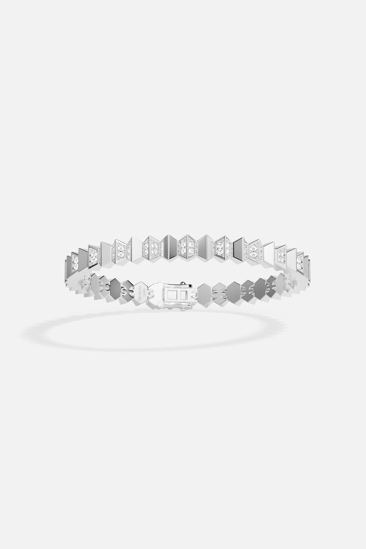 Silver bracelet with geometric design on a white background