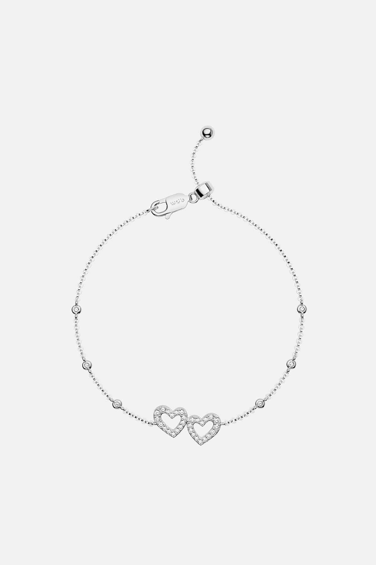 APM MONACO silver bracelet with heart design on a white background