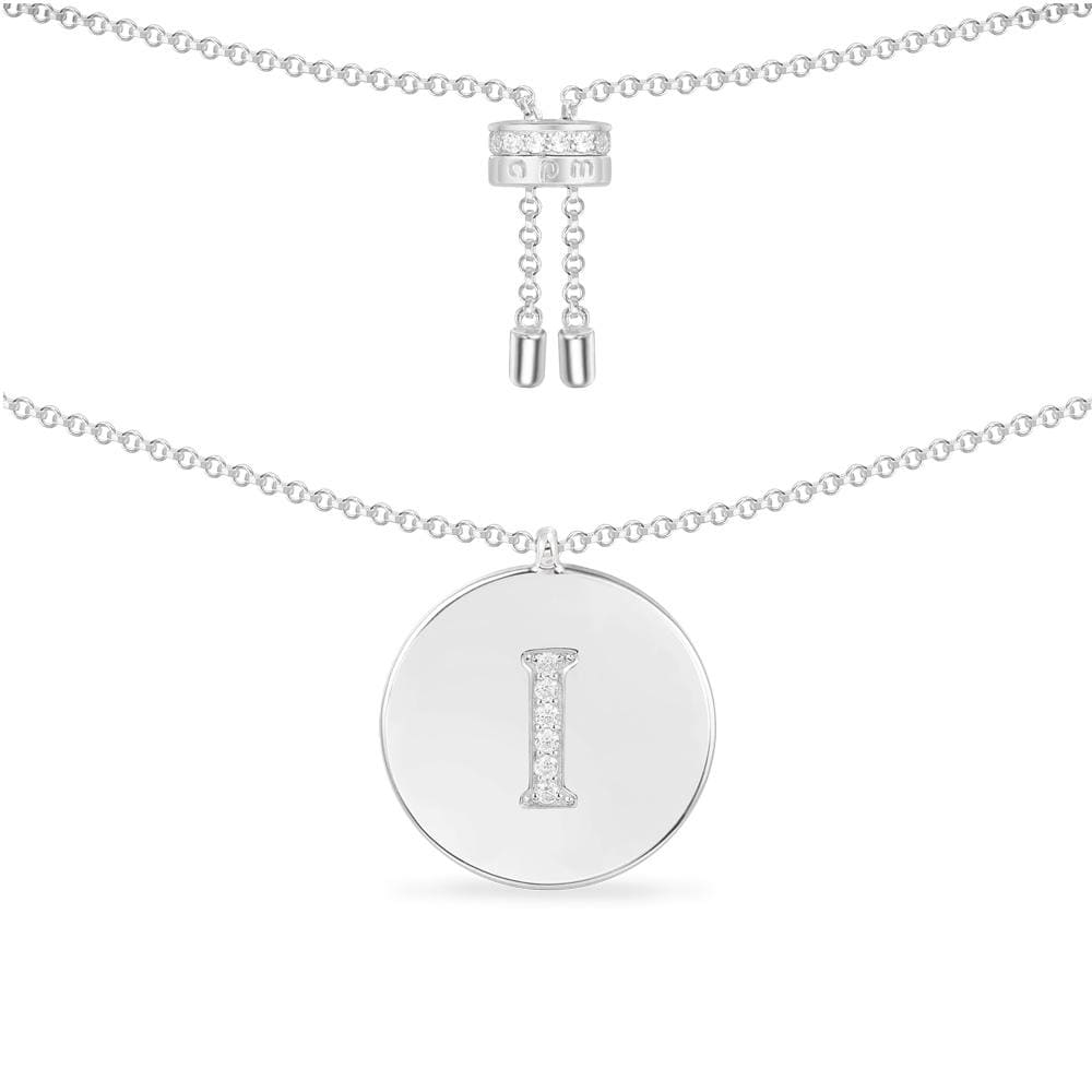 Necklaces APM Monaco, white round pendant featuring the letter I encrusted in pavé diamonds.