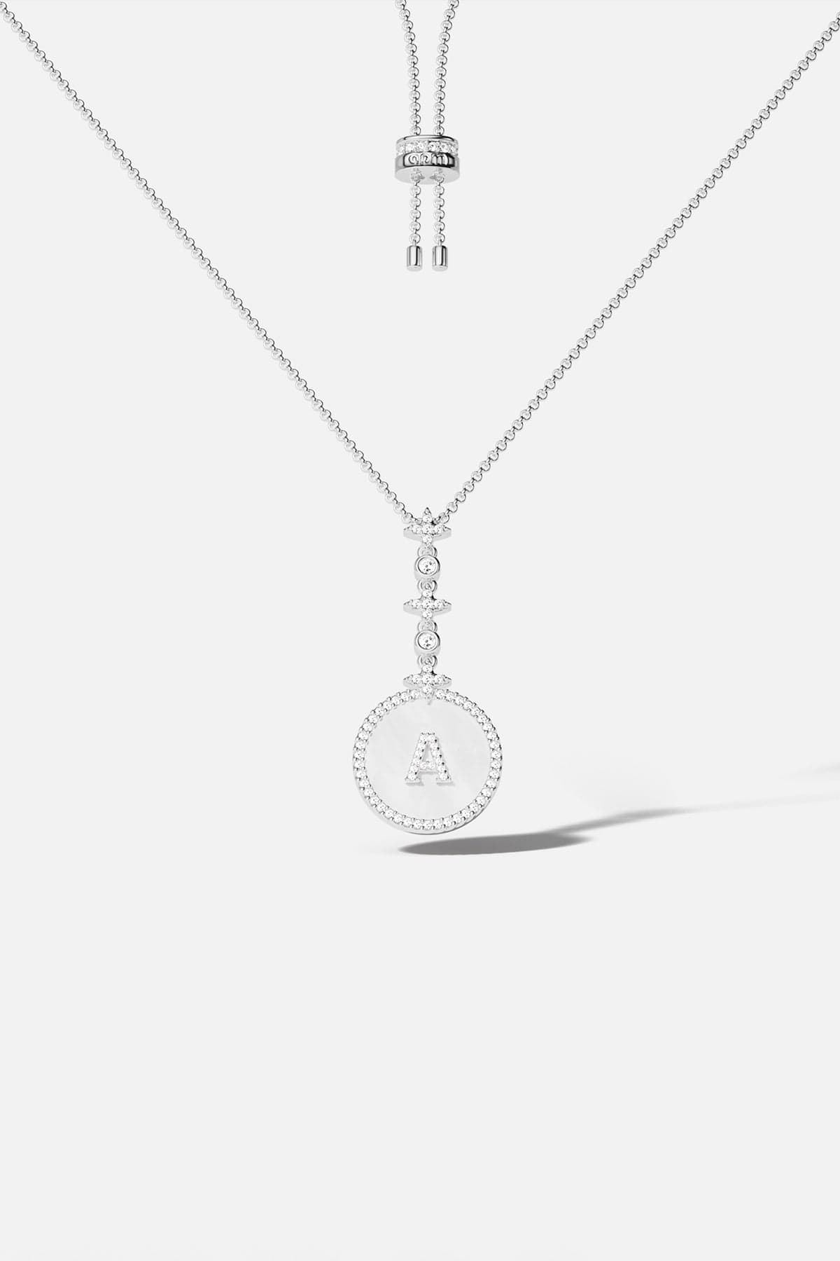 Necklaces APM Monaco, adjustable pendant necklace with pavé-diamond letter A in silver-tone.