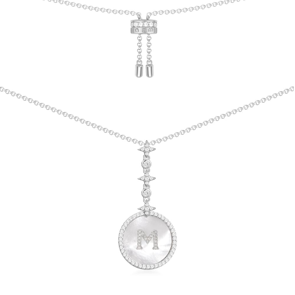 Necklaces APM Monaco: silver chain with a white mother-of-pearl pendant, featuring a silver M charm and diamond accents.