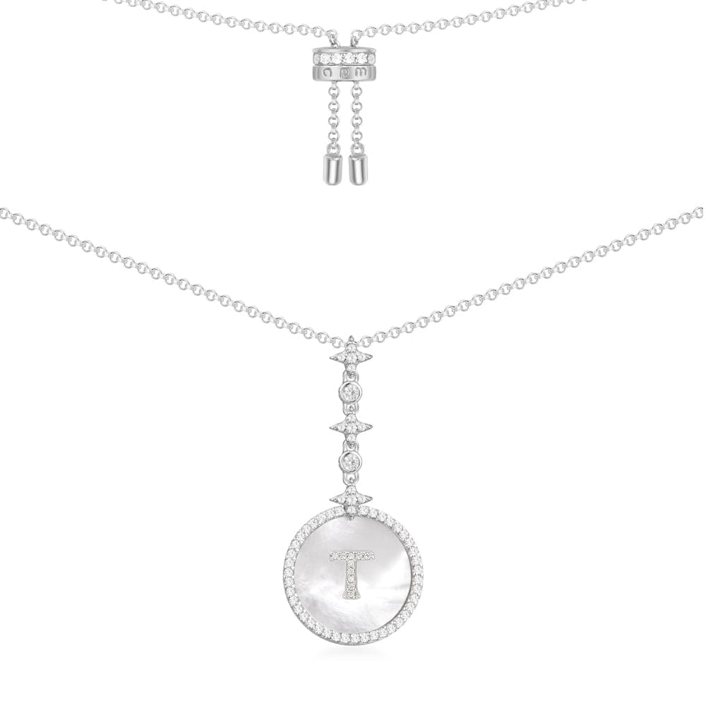 Necklaces APM Monaco: White gold necklace with a round pendant featuring a T at center, surrounded by pavé diamonds, on a slim adjustable chain.
