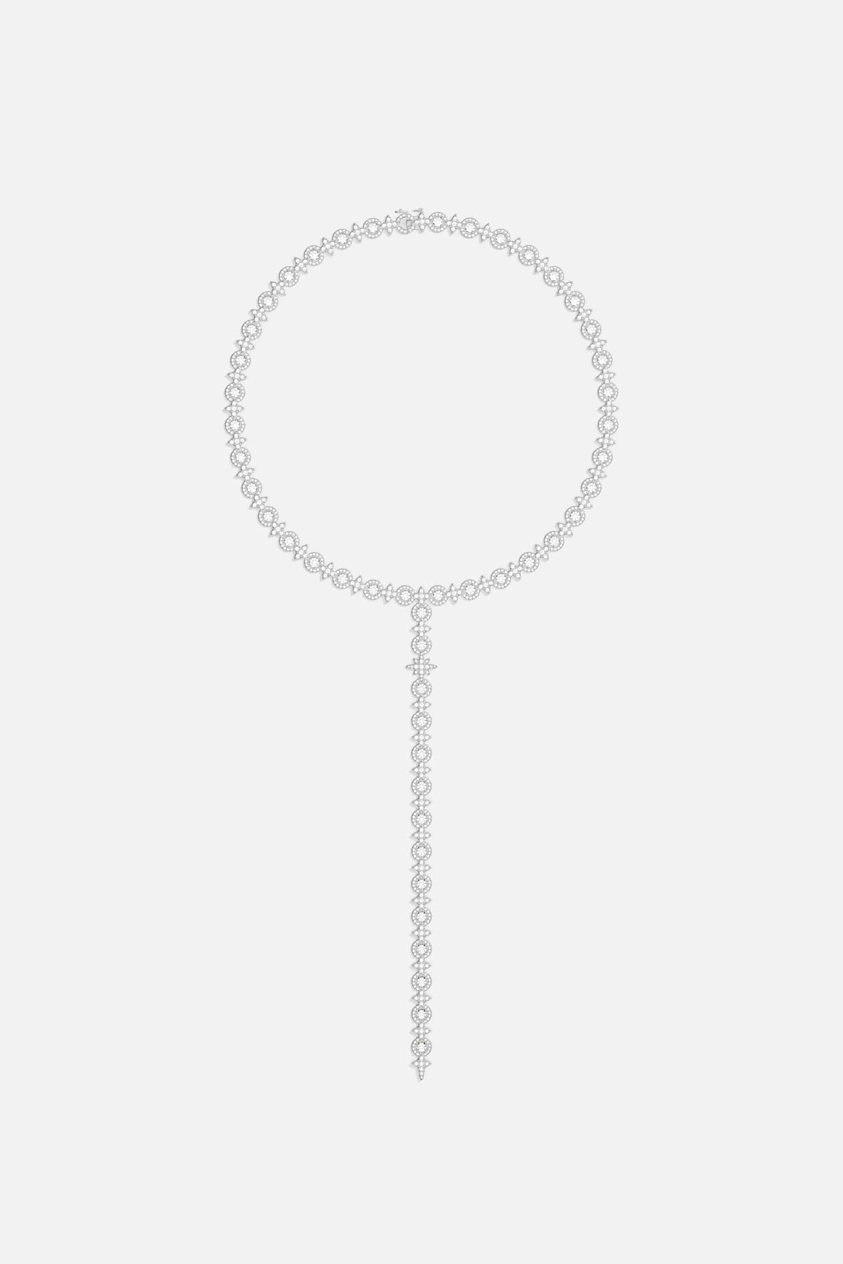 Necklaces APM Monaco. Silver-tone choker with circular link band and elongated strand featuring pavé circles and teardrop stones in a Y-drop design.