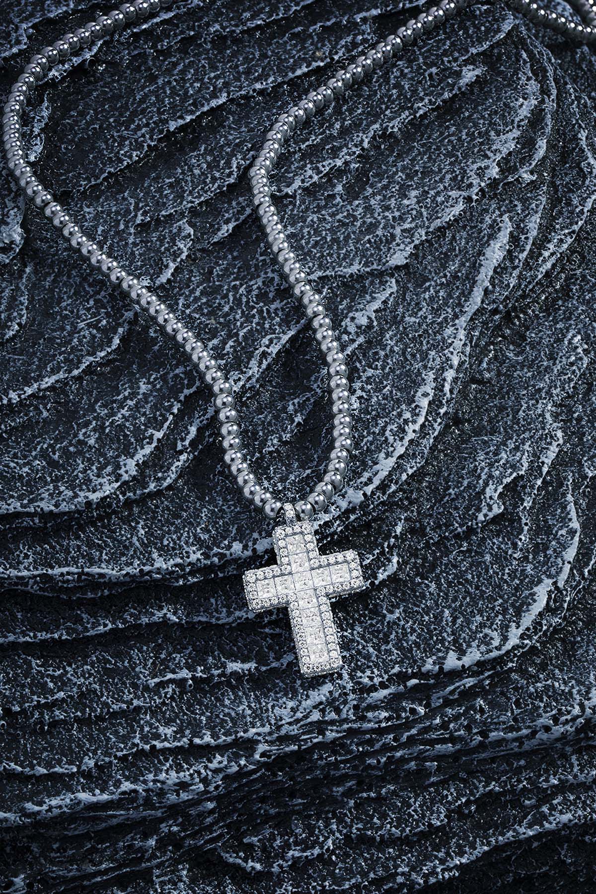 Necklaces APM Monaco white adjustable cross pendant necklace with pavé stones and beads.