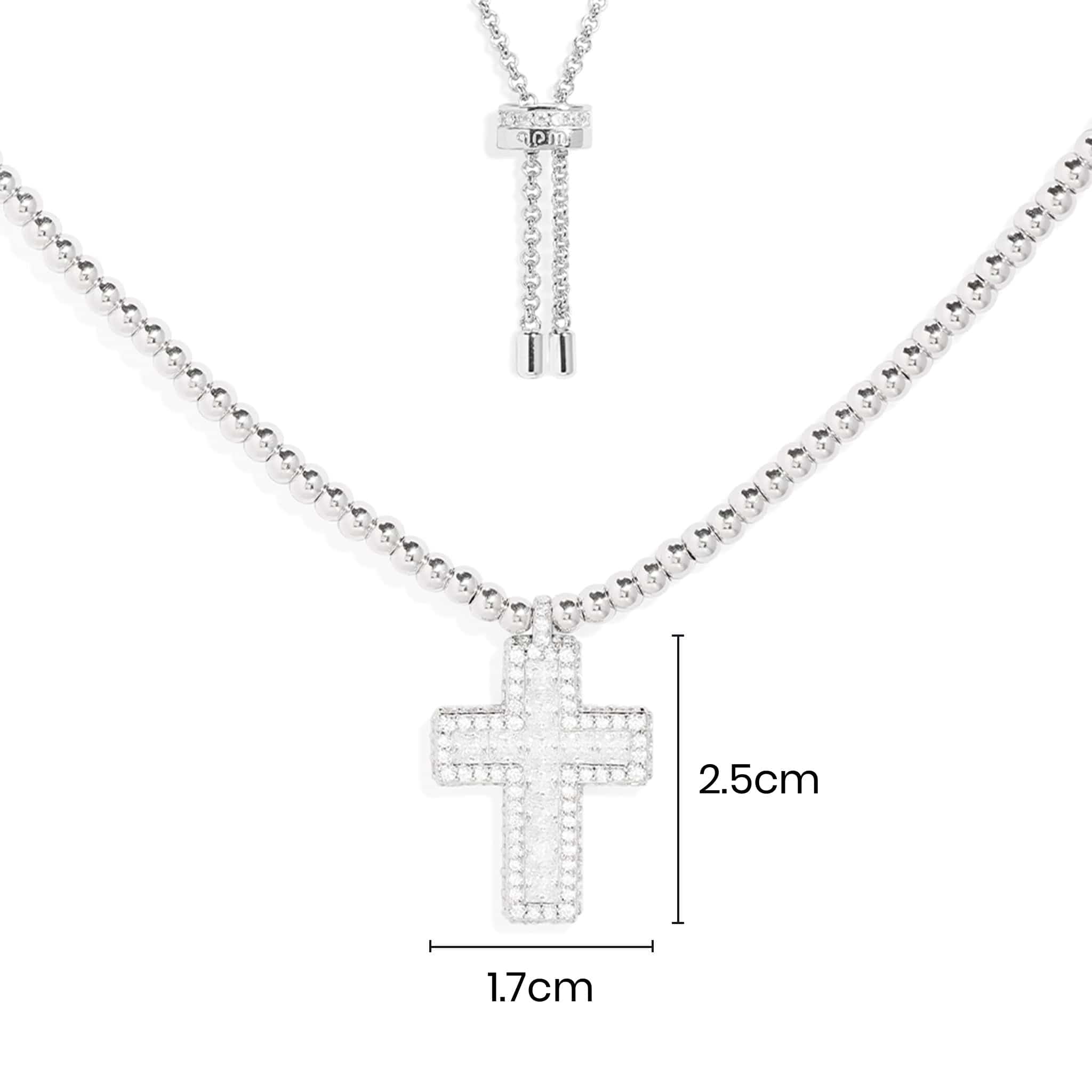 Necklaces APM Monaco, white tone chain with a cross charm and dimensions inscribed on the charm.
