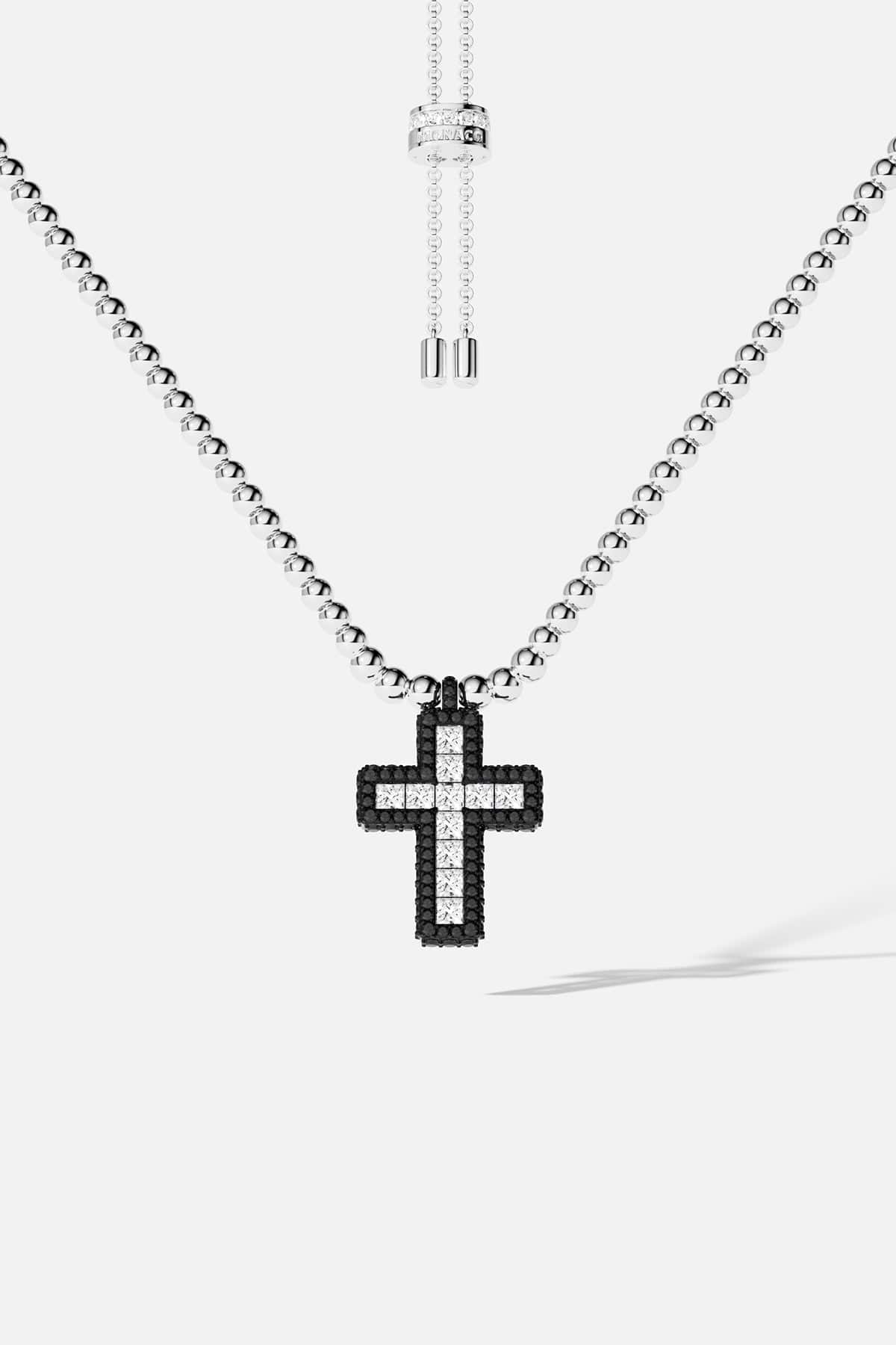 Necklaces APM Monaco: adjustable necklace with small silver beads and a pavé cross pendant in black and white stones.