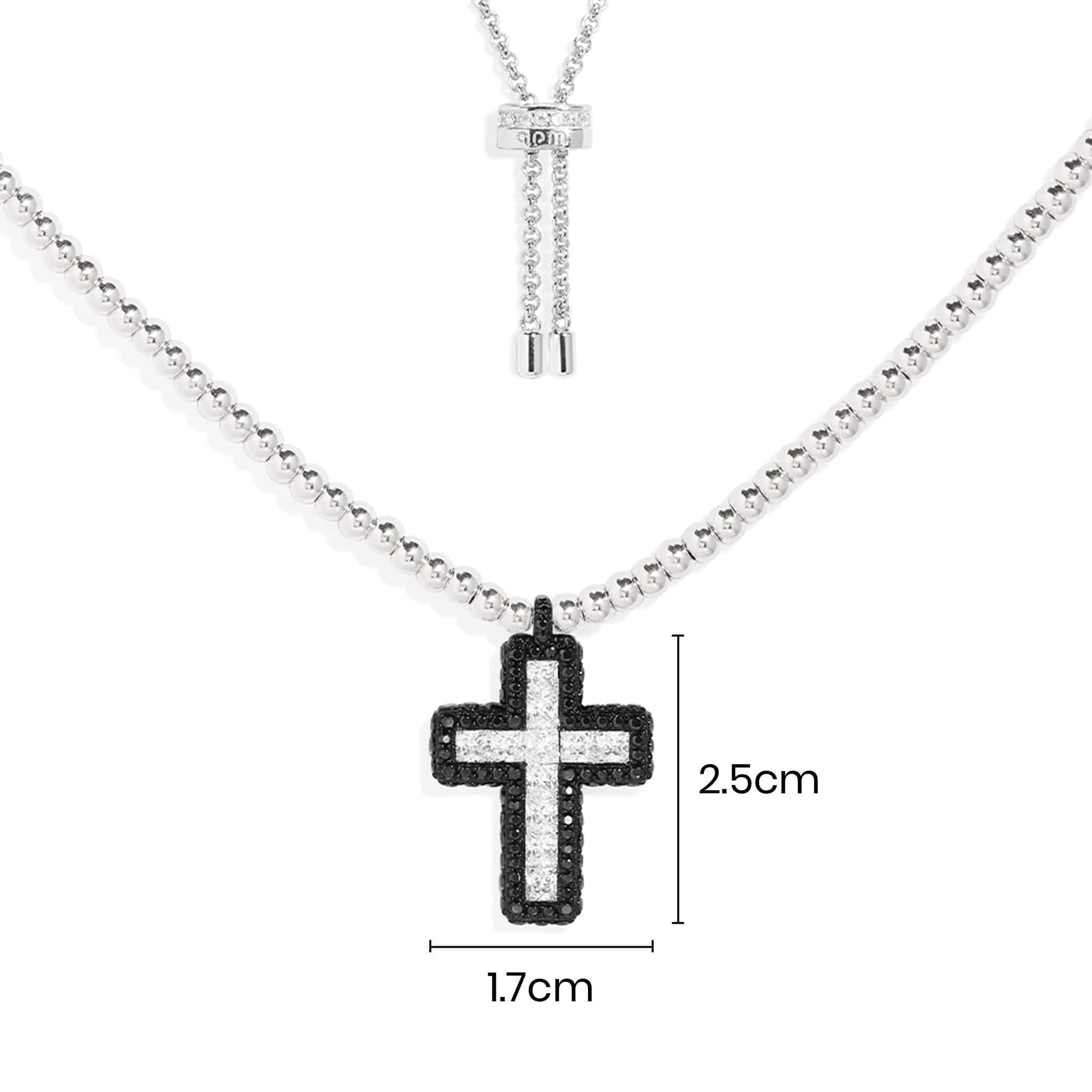 Necklaces APM Monaco: silver chain with a black and white cross pendant, approx. 2.5 cm high by 1.7 cm wide.