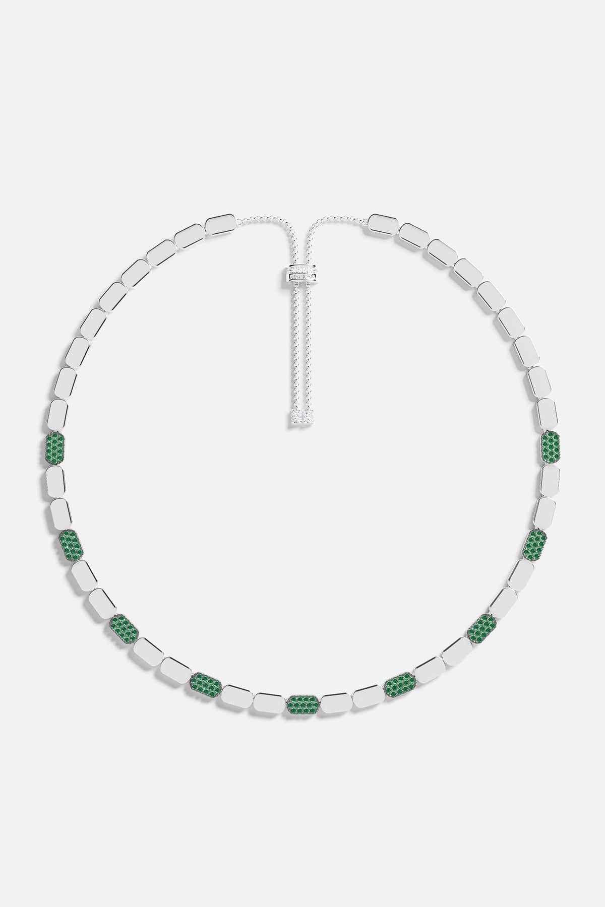 Necklace with green stones on a white background