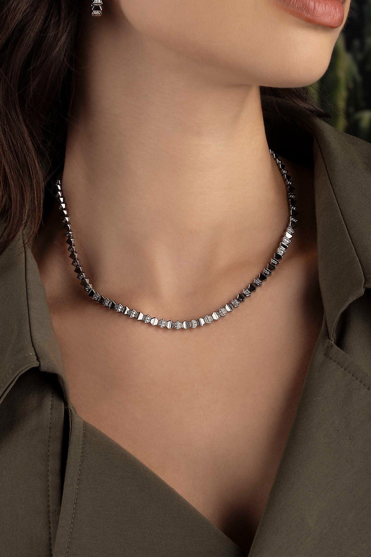 Necklace worn by a model with a neutral background