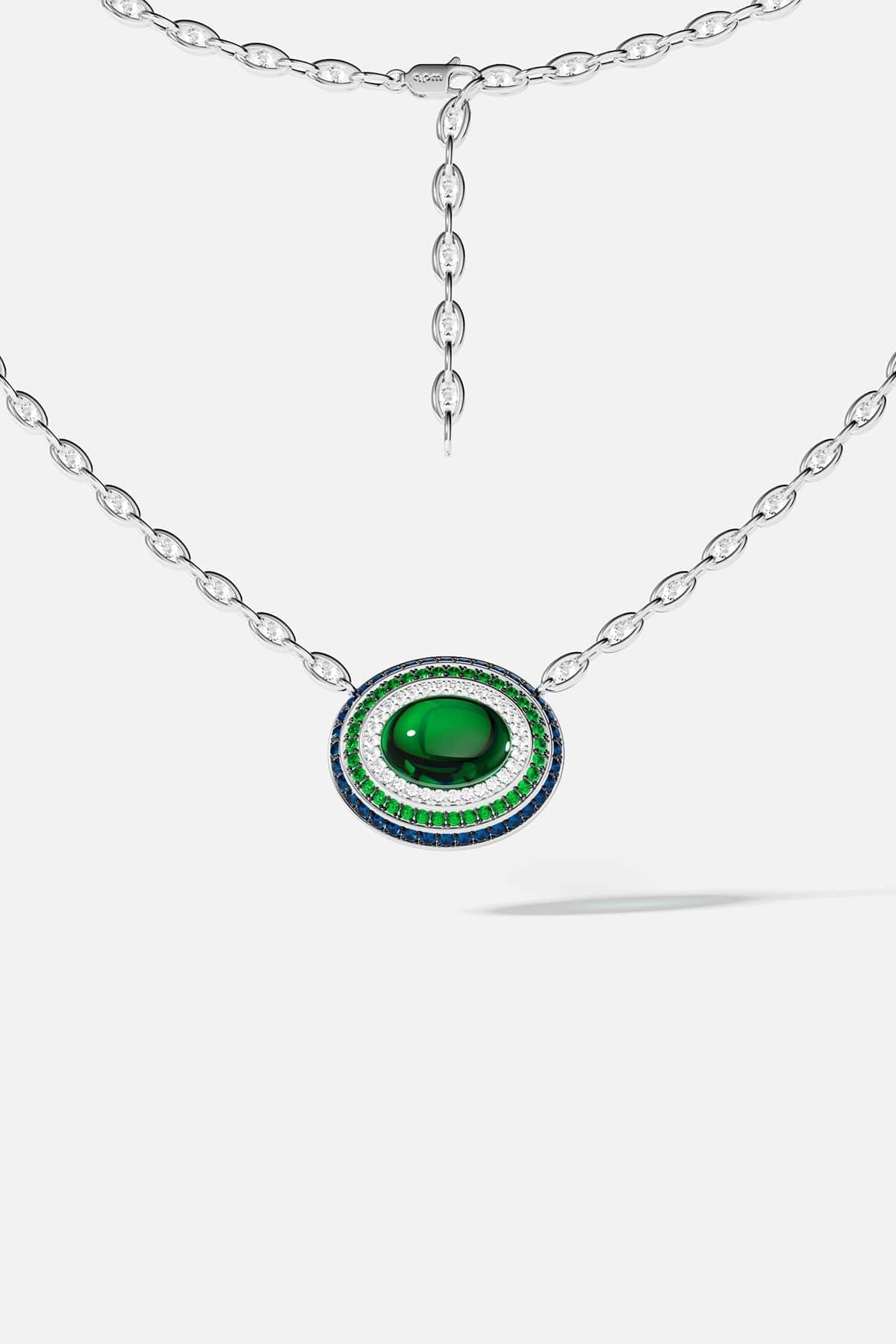Silver necklace with a green stone pendant on a white background