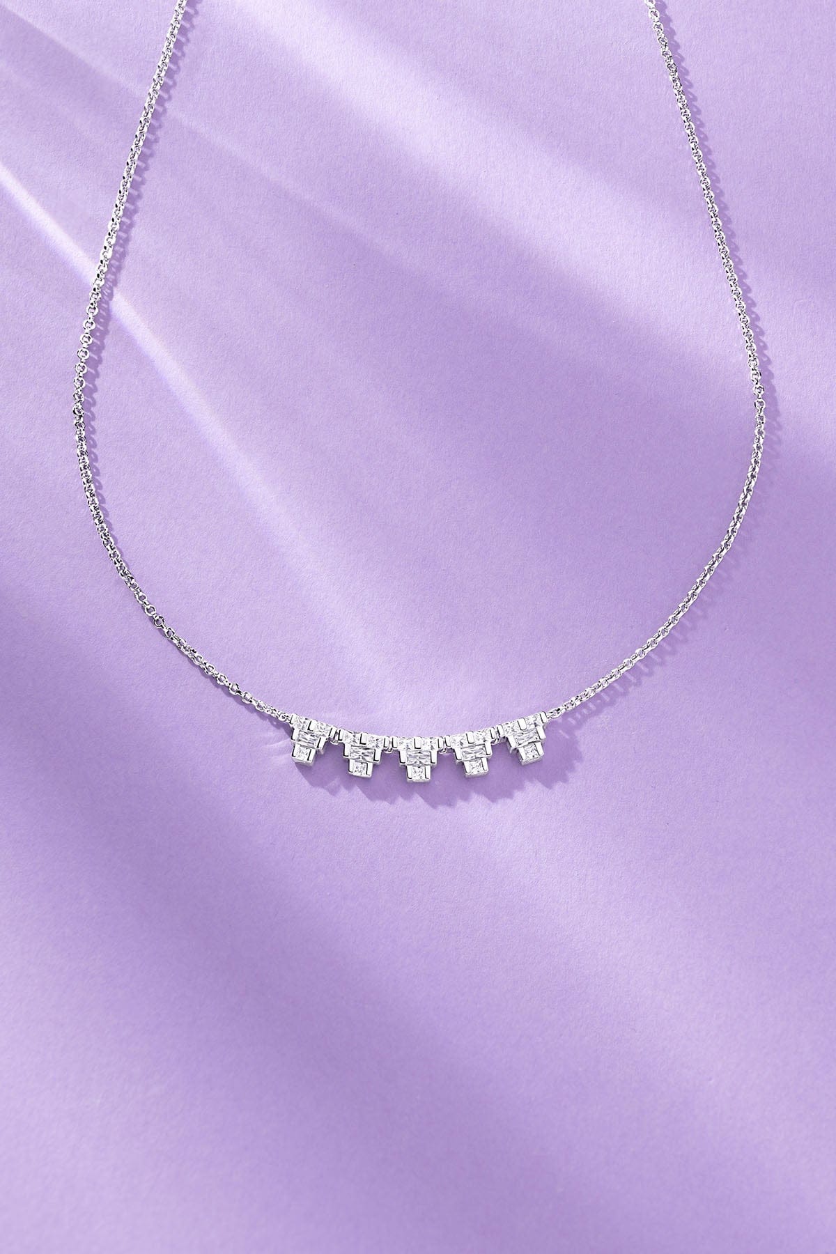 Art Deco Adjustable Necklace on a purple background