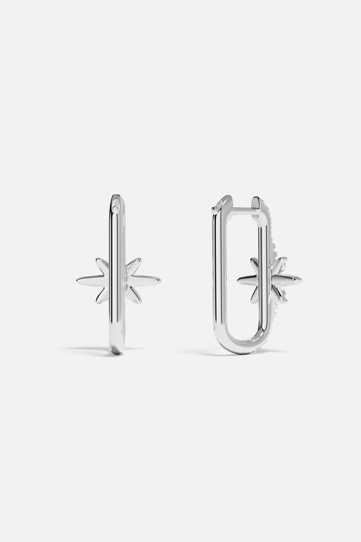 Earrings APM Monaco, silver-tone pair featuring a star-shaped and a U-shaped design.
