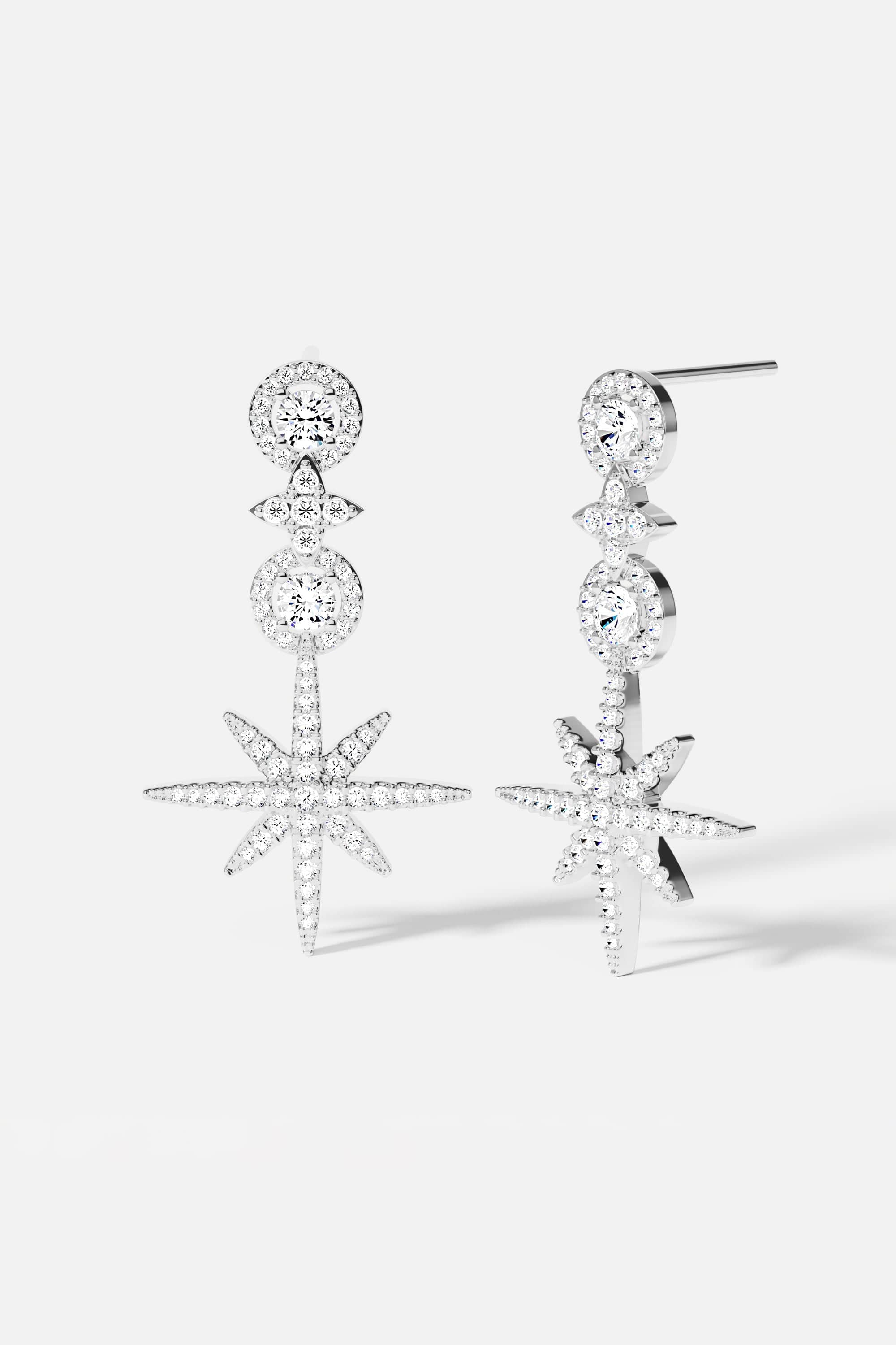 Earrings APM Monaco pavé circle drop earrings in white metal with crystal accents.