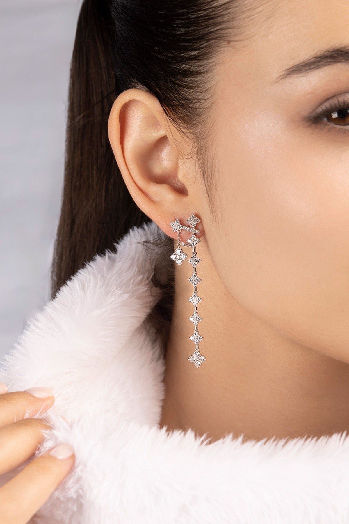 APM MONACO statement spark earrings in silver worn on model