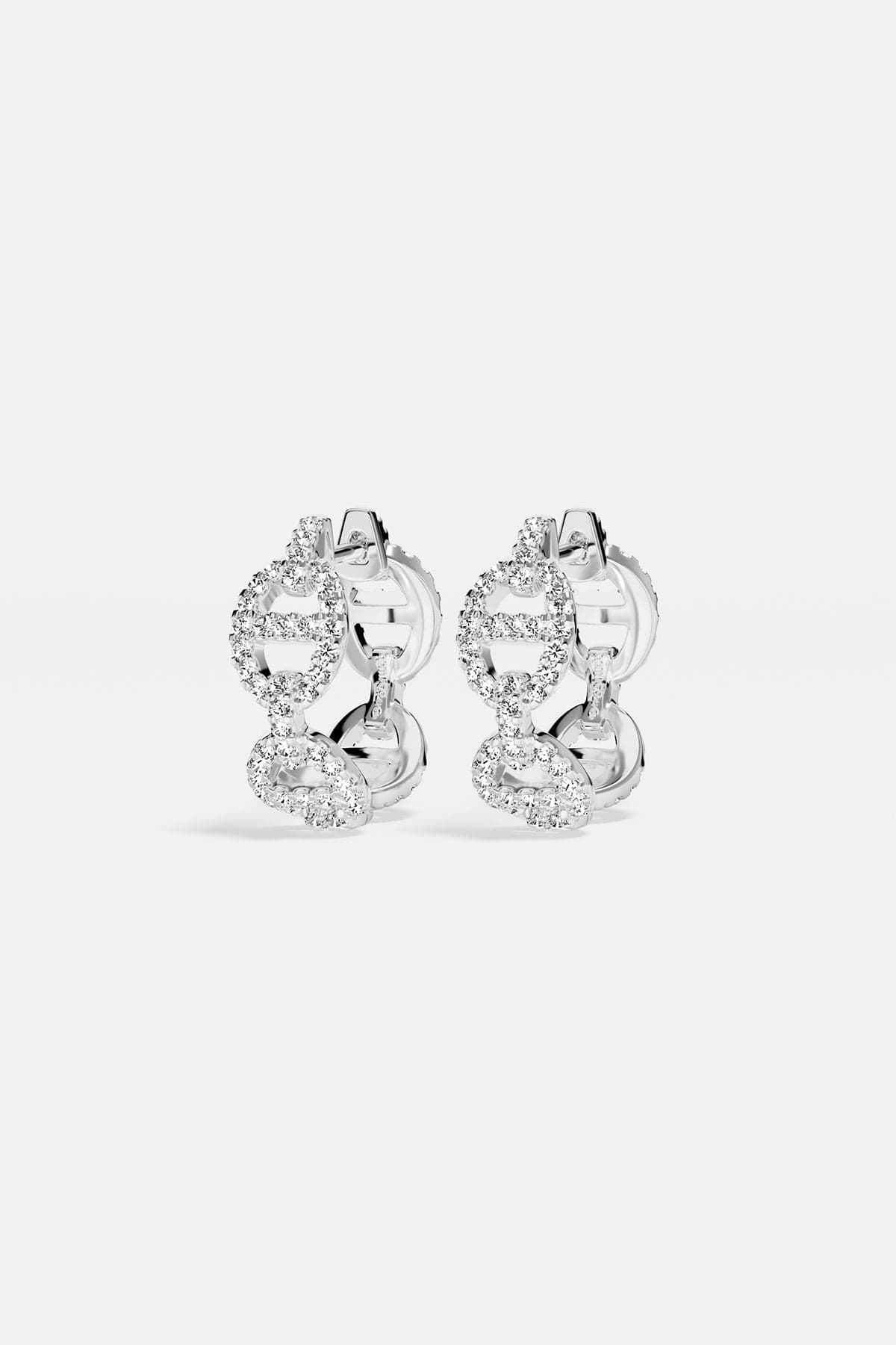 Earrings APM Monaco, silver-tone hoop earrings encrusted with white cubic zirconia.