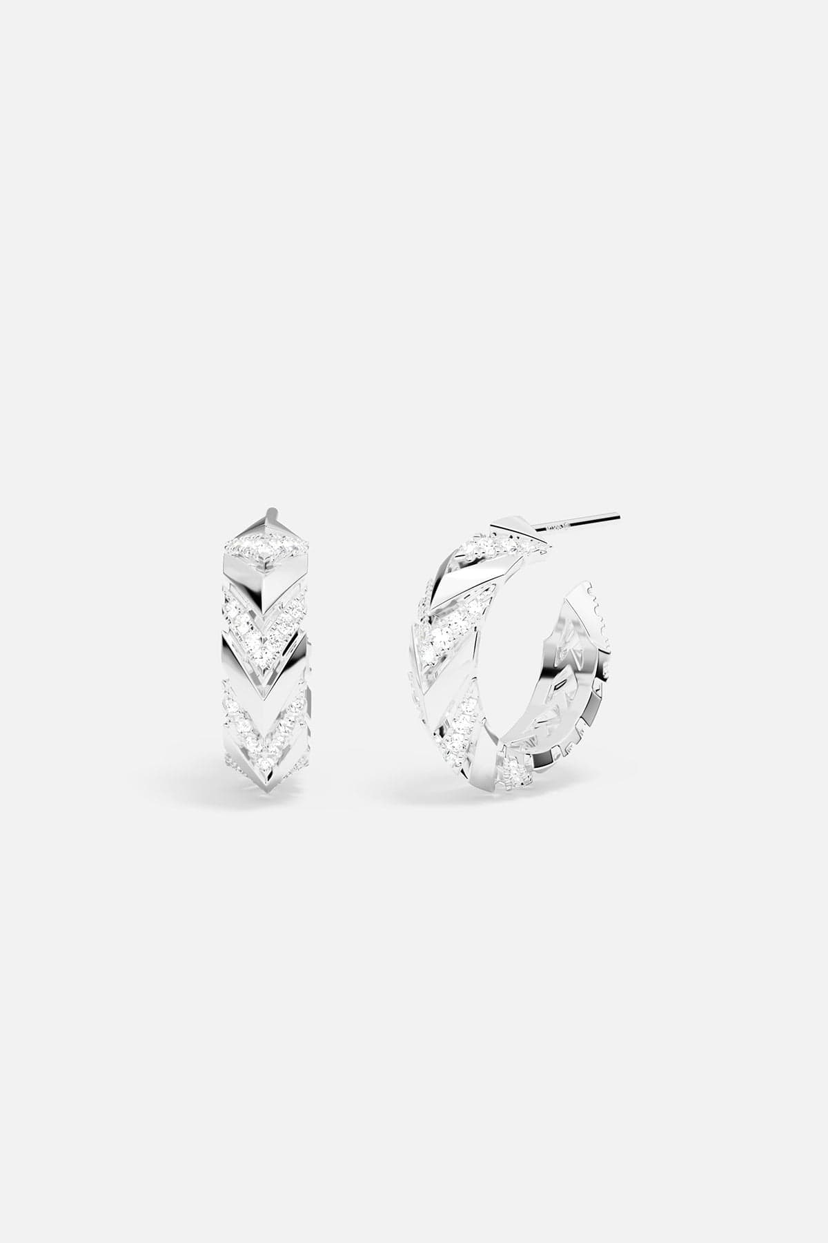 Pair of silver hoop earrings on a white background