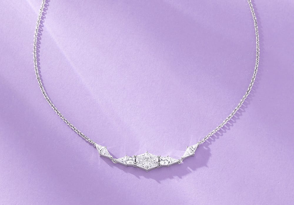APM Monaco Art Deco Necklace on Lilac Background