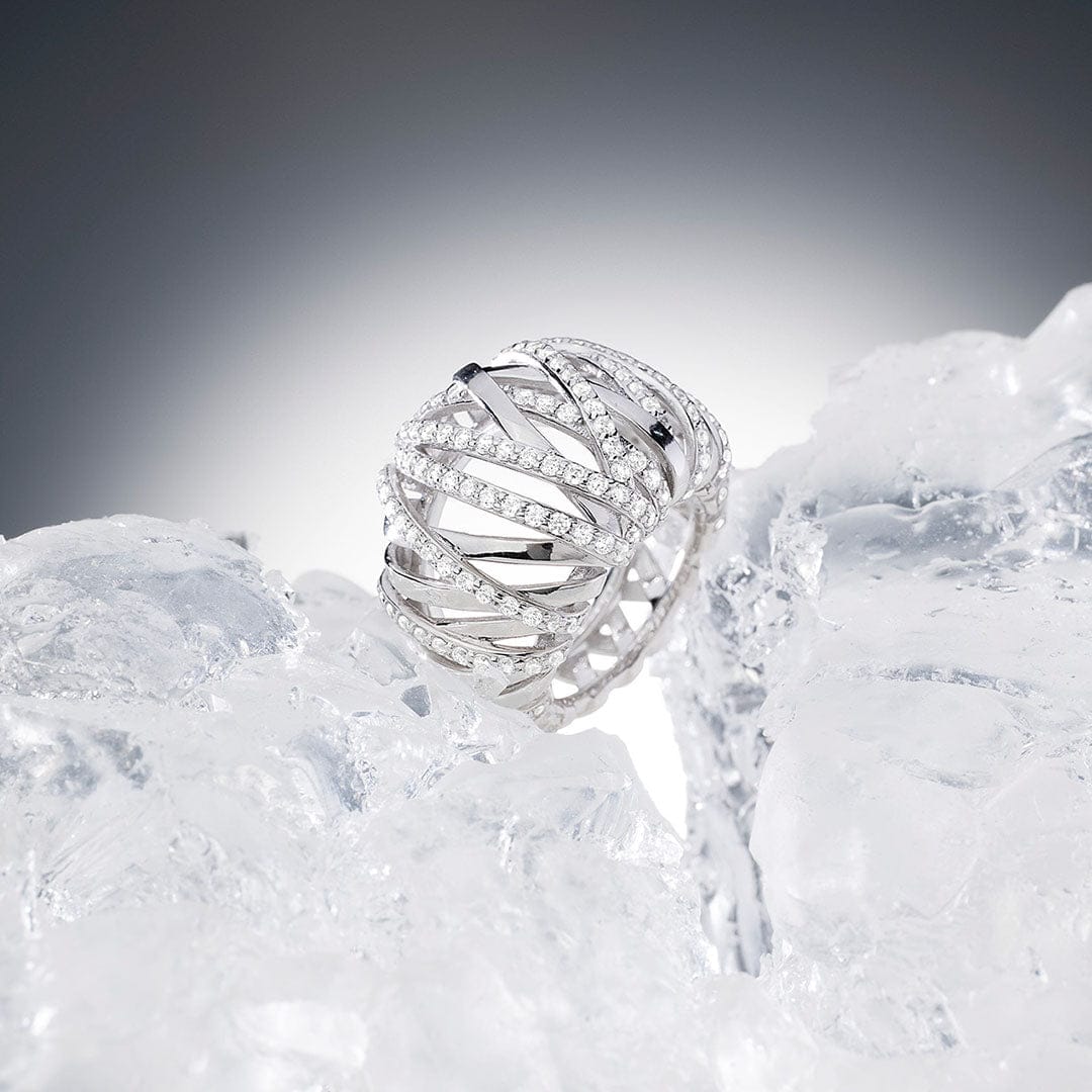 APM Monaco Gift Ideas Silver Enclace Pave Ring on Ice background