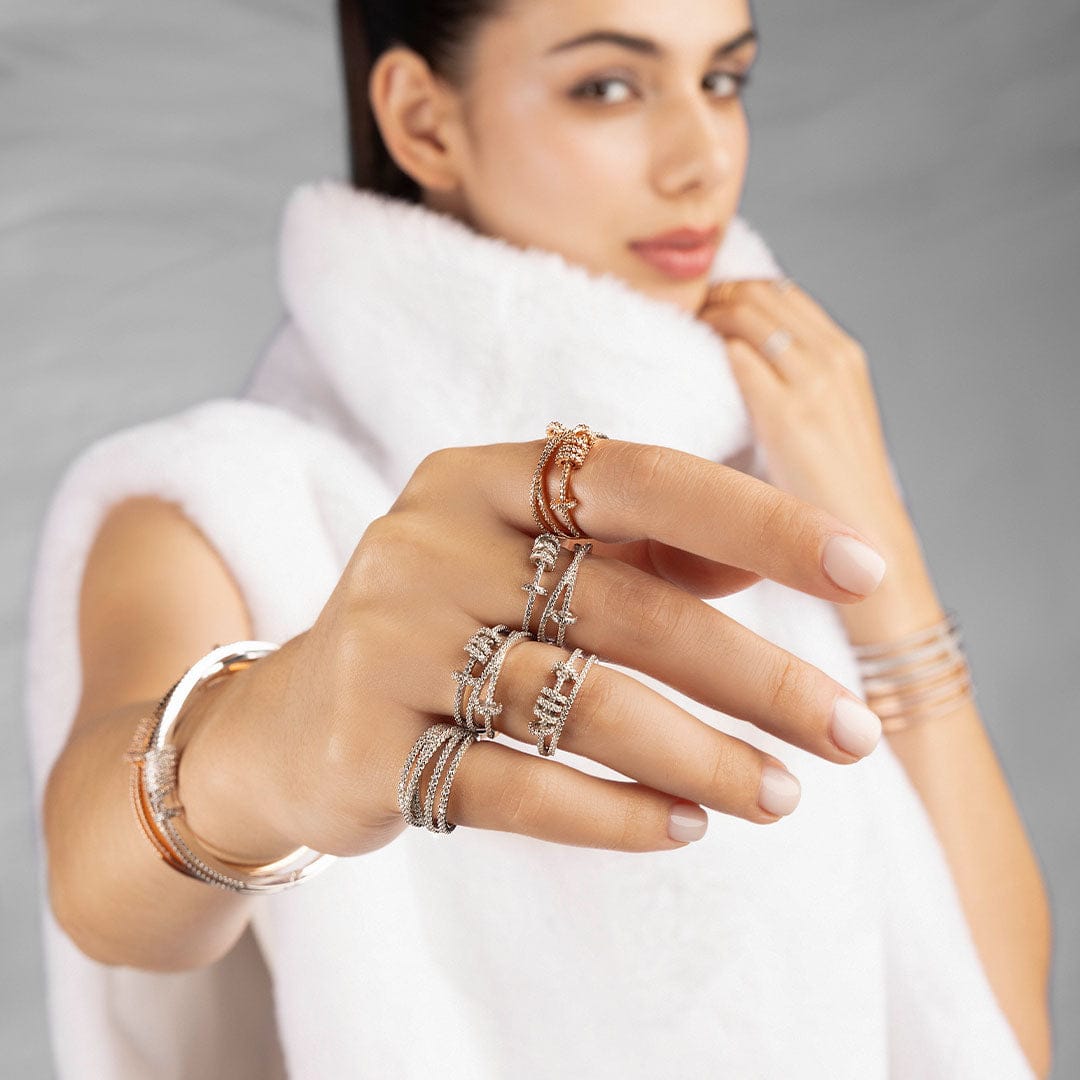 APM Monaco Must Have collection croisette sliding rings worn on hand