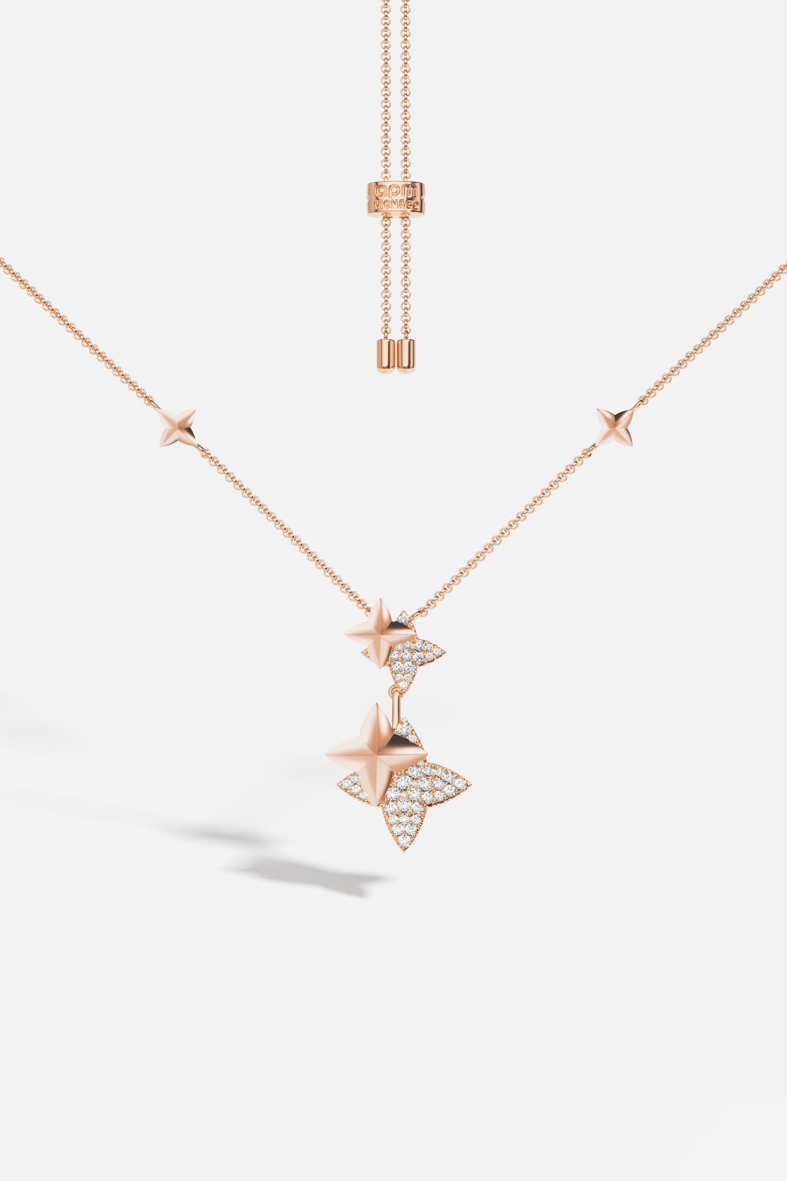 Necklaces APM Monaco, rose gold adjustable necklace with star-shaped pendants, some with inset diamonds.