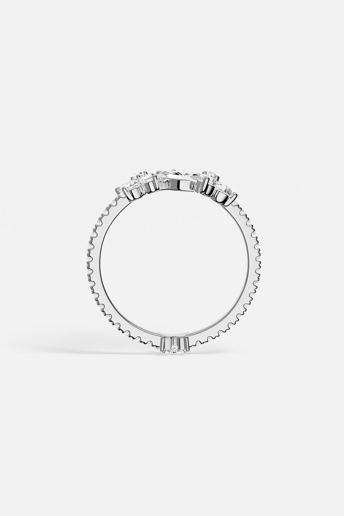 alloy ring with small stones with butterfly shapes on a white background