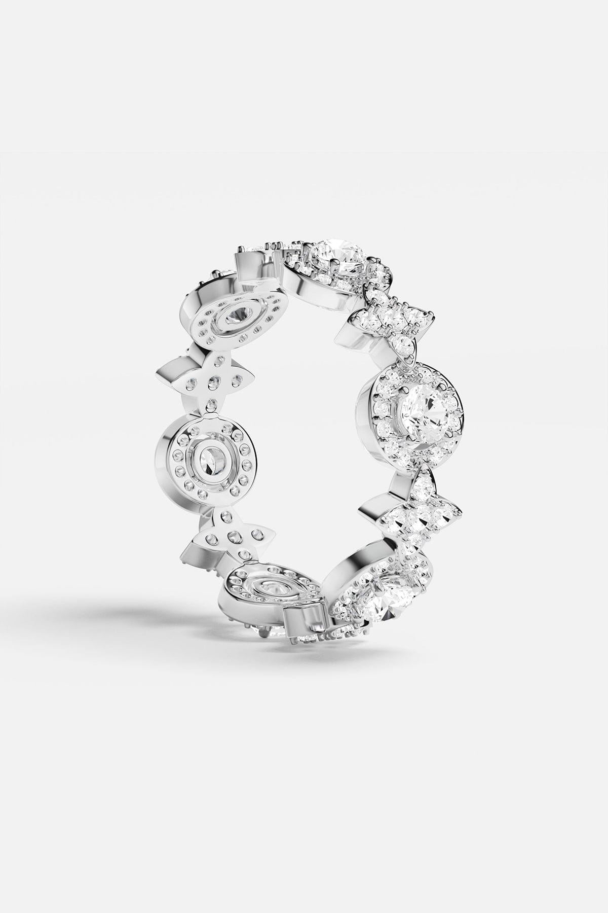 Rings APM Monaco: white pavé circle ring with multiple linked circular stone settings in a silver tone.