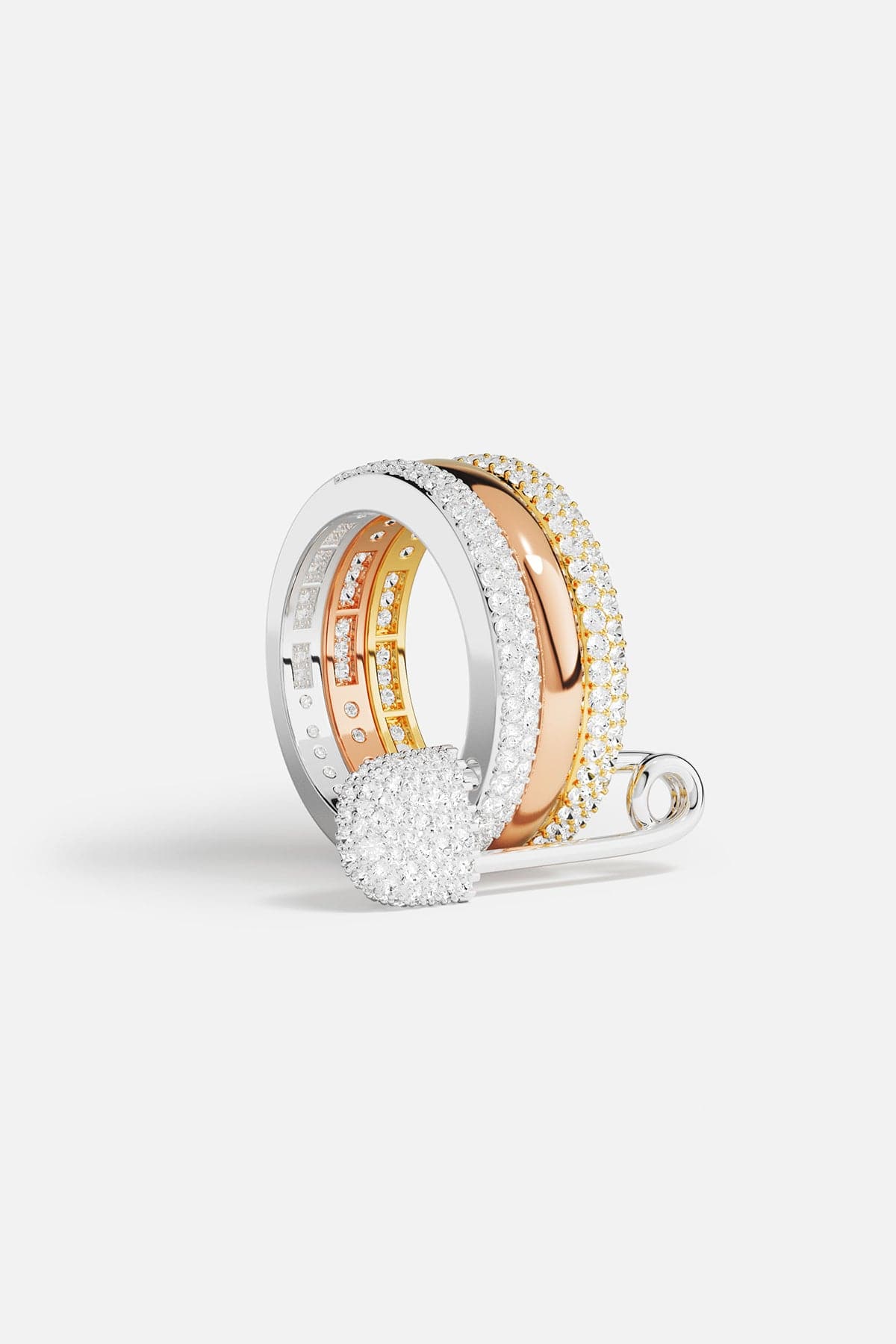 Two rings, one silver and one rose gold with diamond accents, on a light gray background.