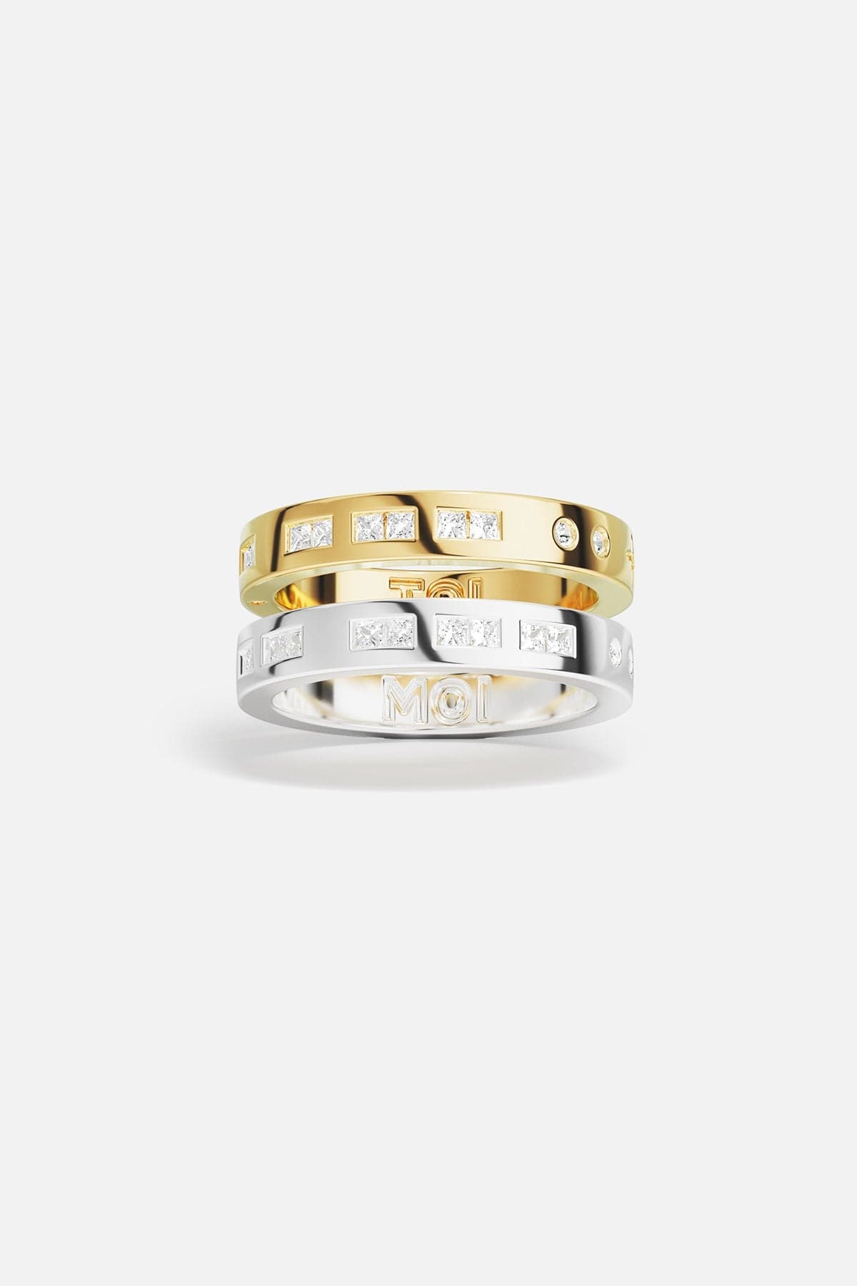 Rings APM Monaco: two stacked rings, yellow gold and white gold, white cubic zirconia, one with MOI engraving.