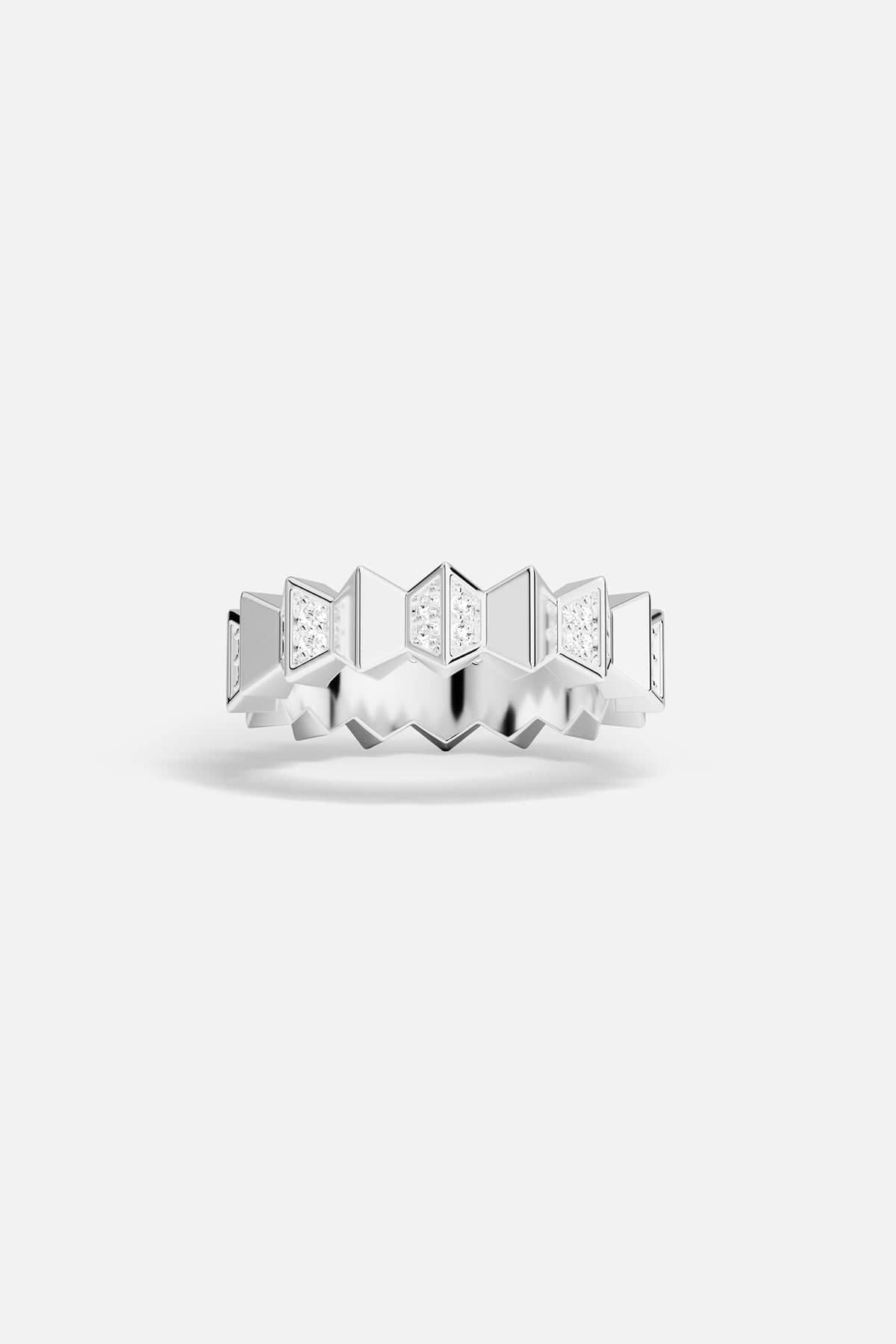 Silver-tone ring with geometric design on a white background