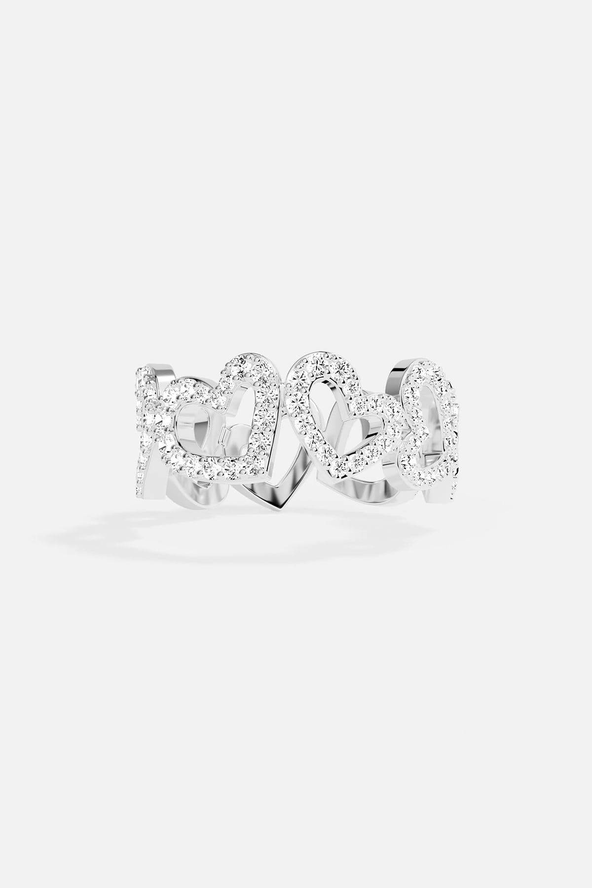 white alloy heart ring on grey background