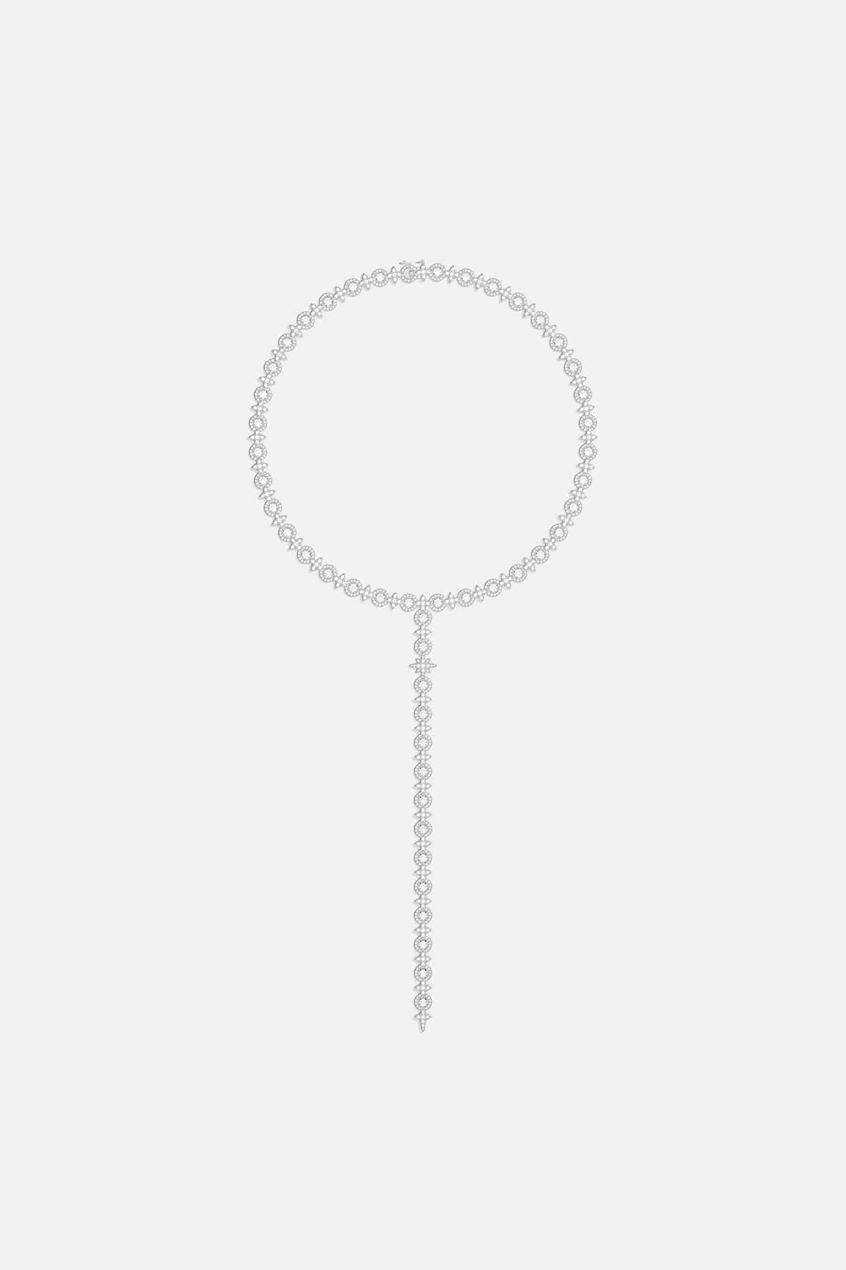 Necklaces APM Monaco. Silver-tone-tone choker with circular link band and elongated strand featuring pavé circles and teardrop stones in a Y-drop design.