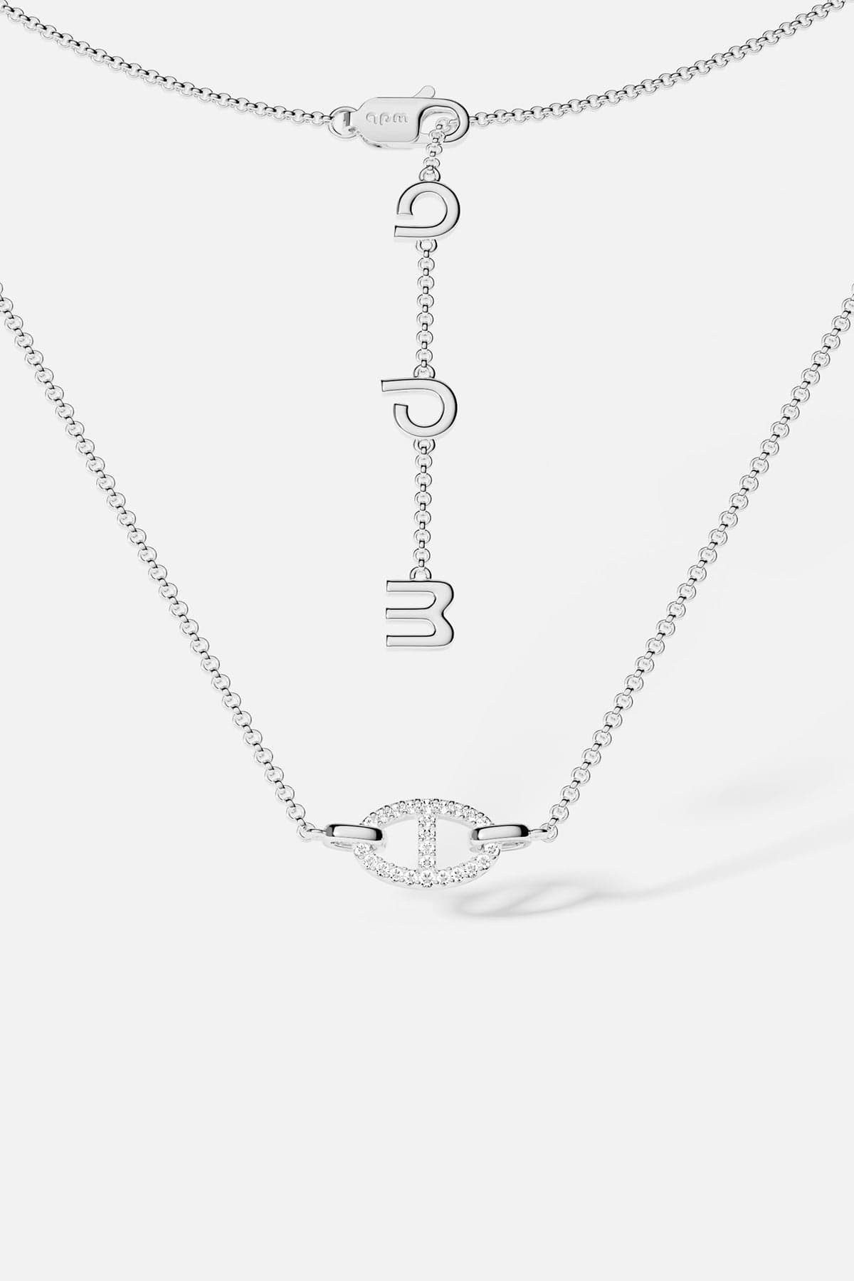 Necklaces APM Monaco, white tone, maille marine chain with a pendant of three hanging letters.
