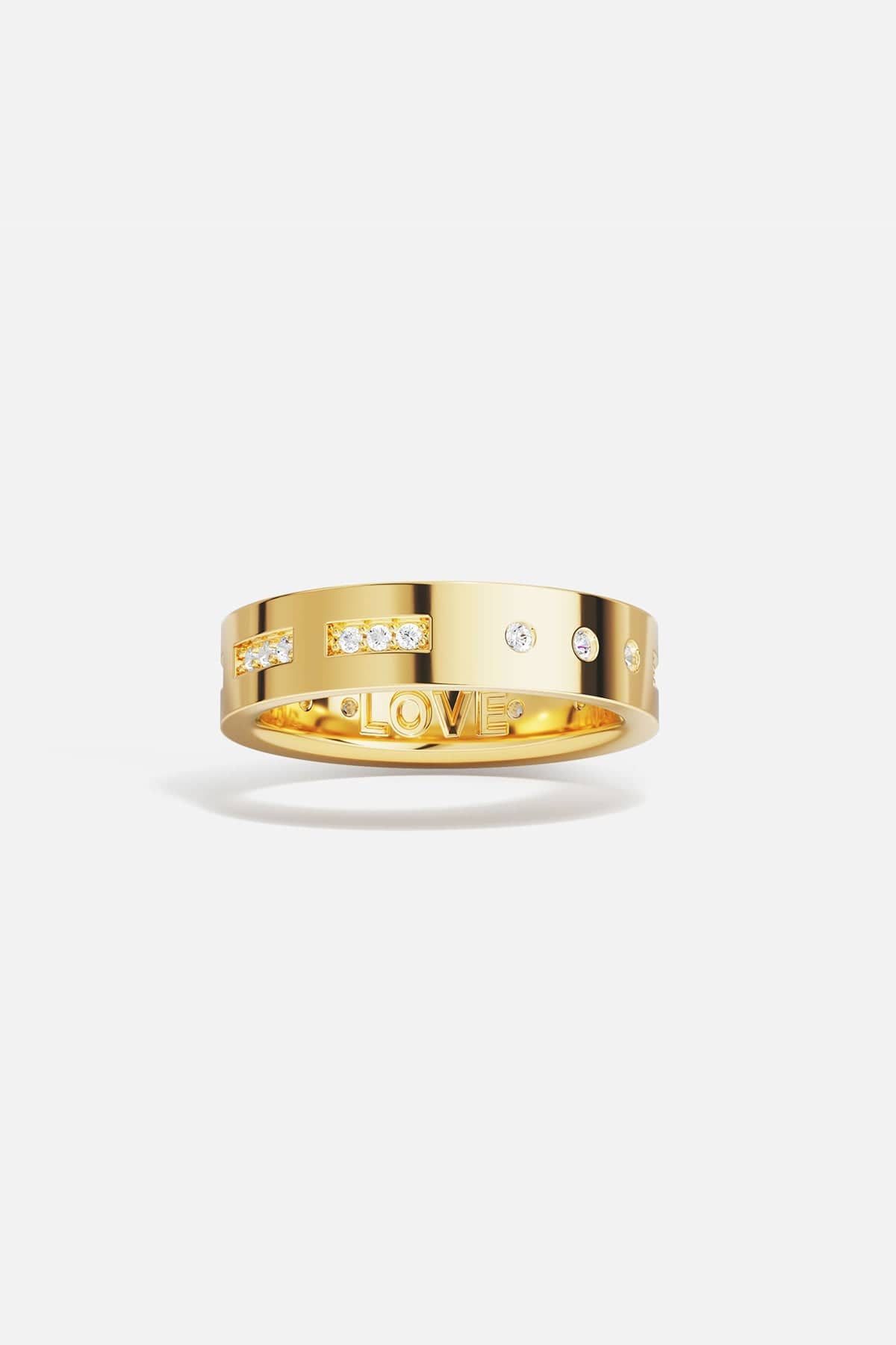 Rings APM Monaco. Yellow gold ring with white cubic zirconia on the outside and 'LOVE' engraved on the inside.